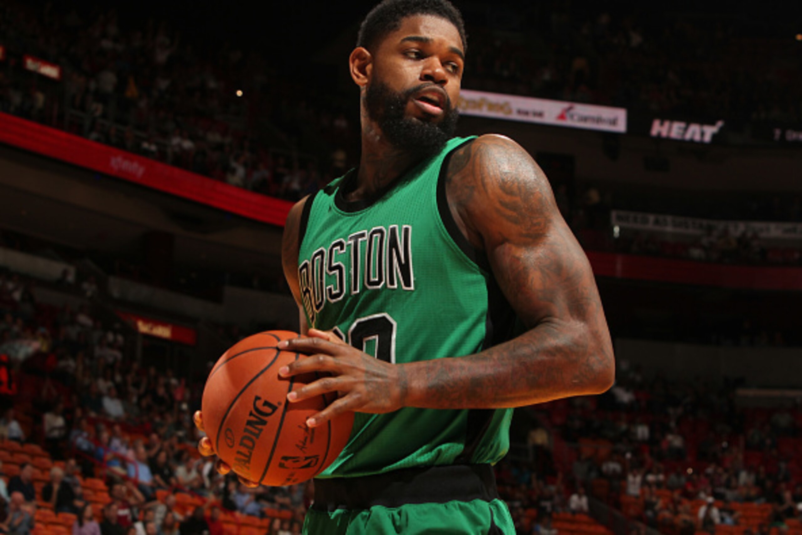 MIAMI, FL - NOVEMBER 30: Amir Johnson #90 of the Boston Celtics handles the ball against the Denver Nuggets on November 30, 2015 at American Airlines Arena in Miami, Florida.  NOTE TO USER: User expressly acknowledges and agrees that, by downloading and o