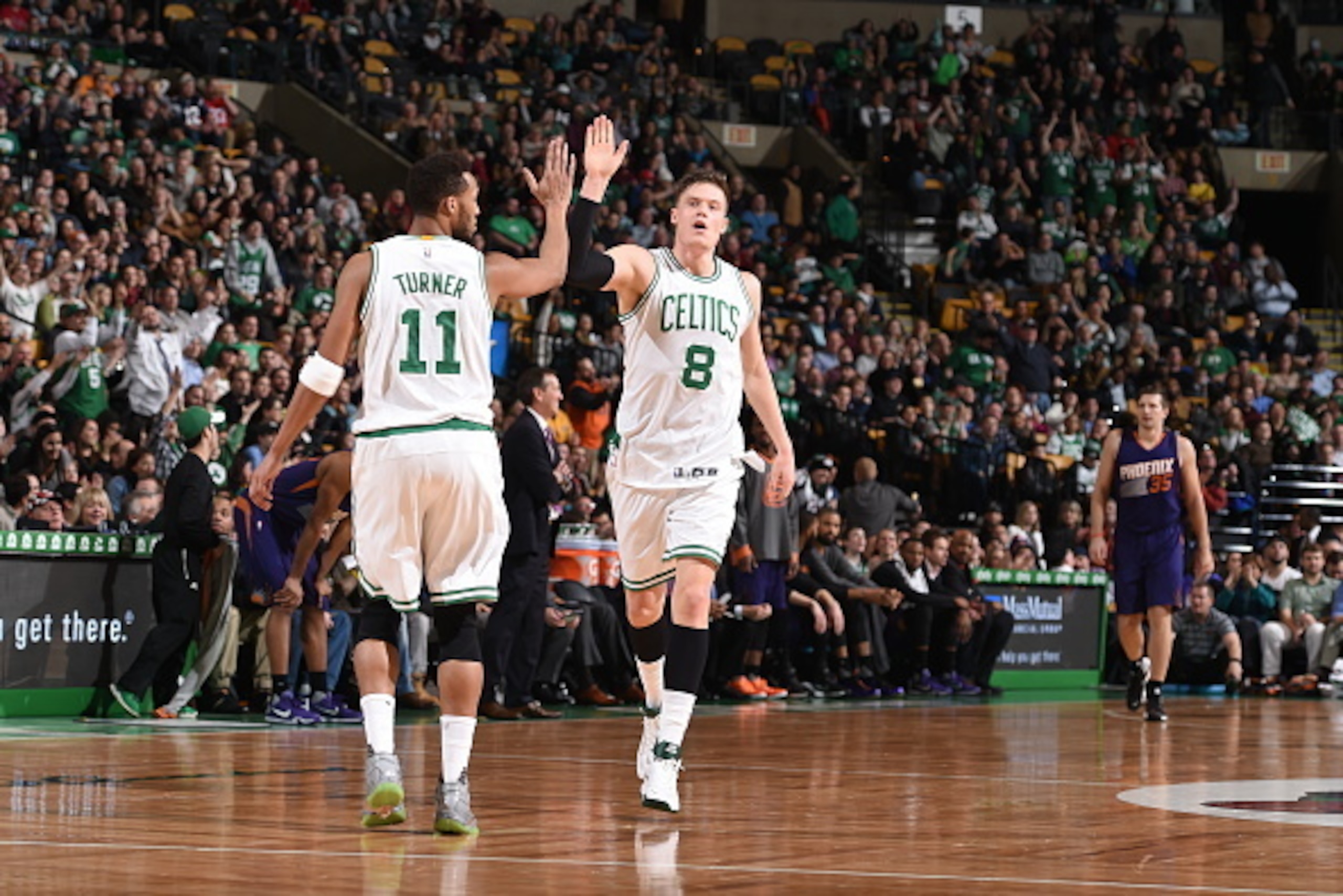 BOSTON, MA - JANUARY 15:  Jonas Jerebko #8 of the Boston Celtics high fives Evan Turner #11 of the Boston Celtics during the game against the Phoenix Suns on January 15, 2016 at the TD Garden in Boston, Massachusetts.  NOTE TO USER: User expressly acknowl