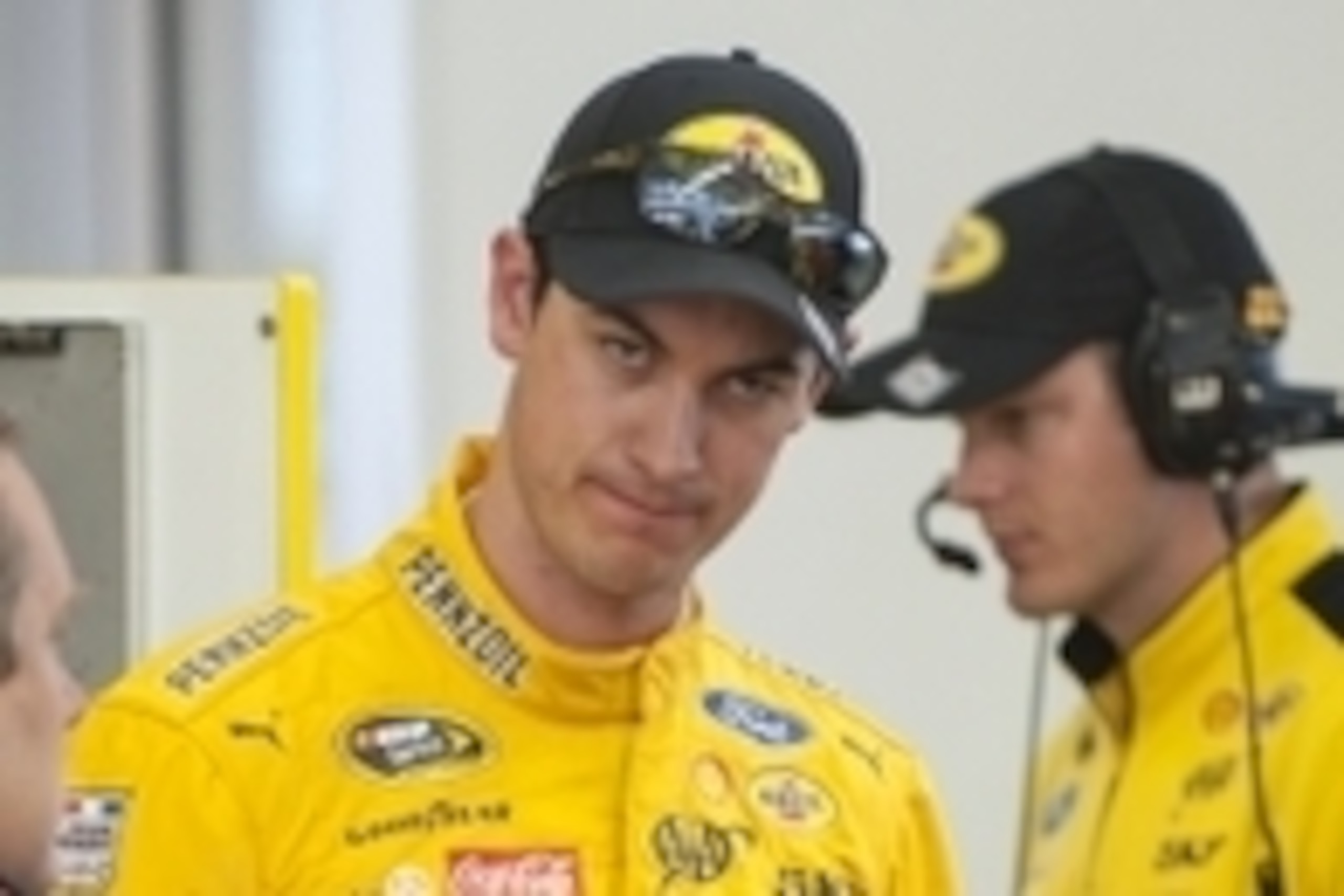 Mar 5, 2016; Las Vegas, NV, USA; NASCAR Sprint Cup driver Joey Logano talks with his crew inside the garage after practicing for the Kobalt 400 at Las Vegas Motor Speedway. Mandatory Credit: Stephen R. Sylvanie-USA TODAY Sports
