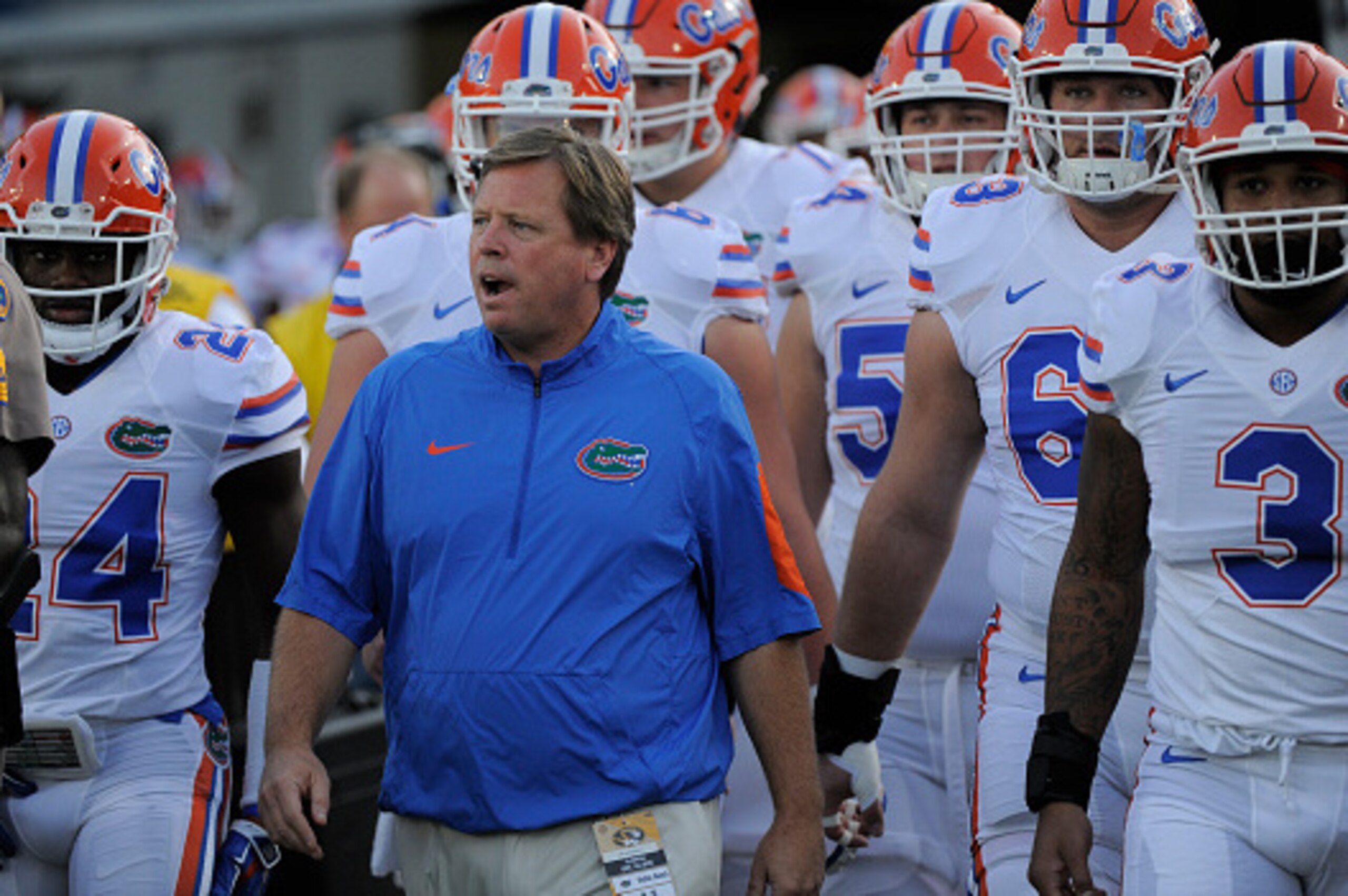 COLUMBIA , MO - OCTOBER 10:  Jim McElwain head coach of the Florida Gators enter Memorial Stadium with members of his team prior to a game against the Missouri Tigers on October 10, 2015 in Columbia, Missouri.  (Photo by Ed Zurga/Getty Images)