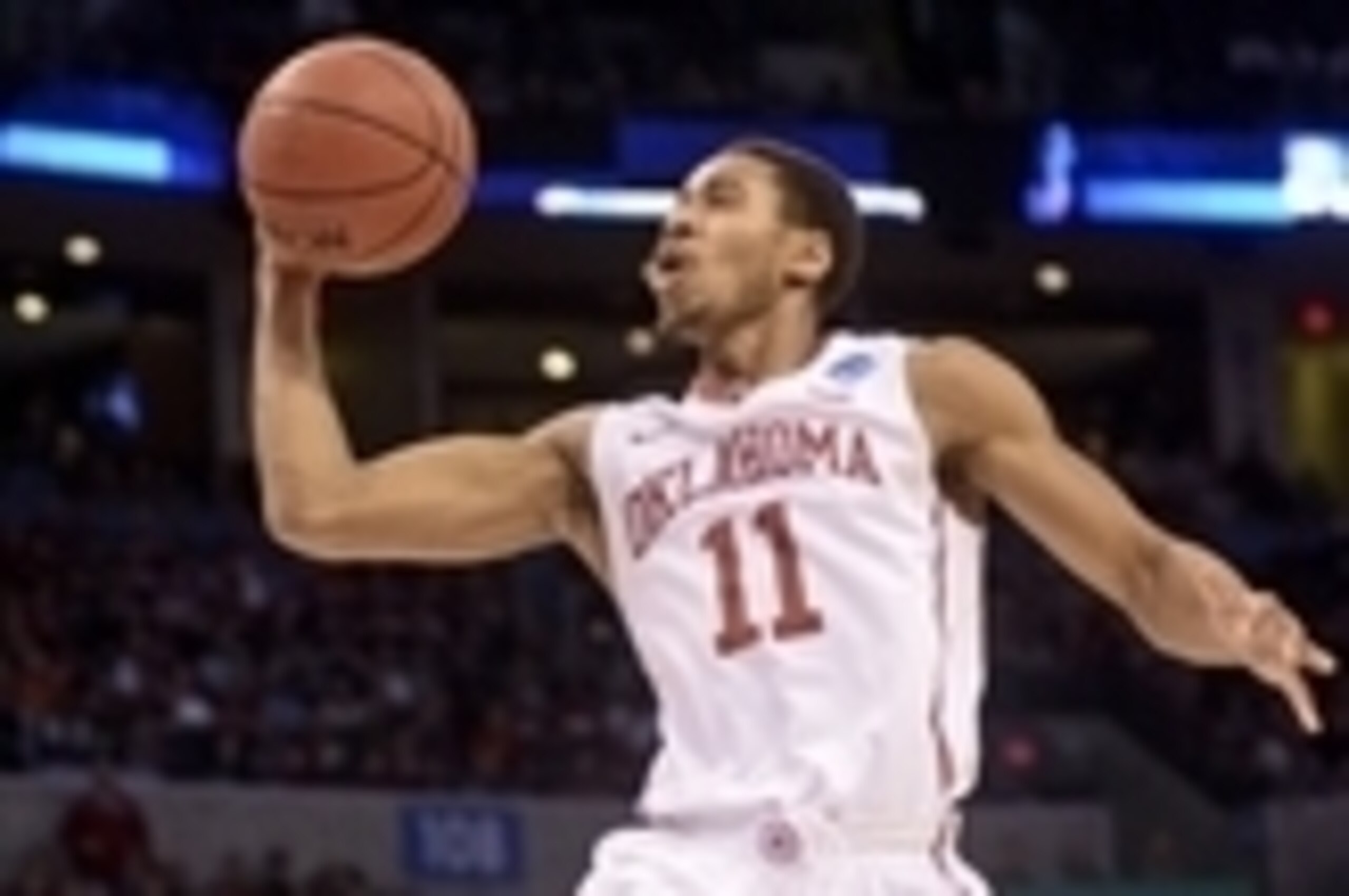 Mar 18, 2016; Oklahoma City, OK, USA; Oklahoma Sooners guard Isaiah Cousins (11) shoots past Cal State Bakersfield Roadrunners forward Kevin Mays (10) during the game in the first round of the 2016 NCAA Tournament at Chesapeake Energy Arena. Mandatory Cre