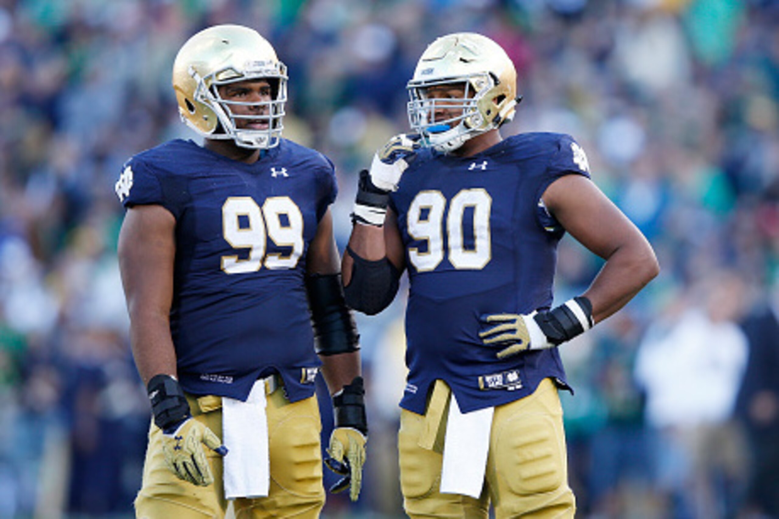 SOUTH BEND, IN - SEPTEMBER 19: Jerry Tillery #99 and Isaac Rochell #90 of the Notre Dame Fighting Irish look on against the Georgia Tech Yellow Jackets during the game at Notre Dame Stadium on September 19, 2015 in South Bend, Indiana. Notre Dame defeated