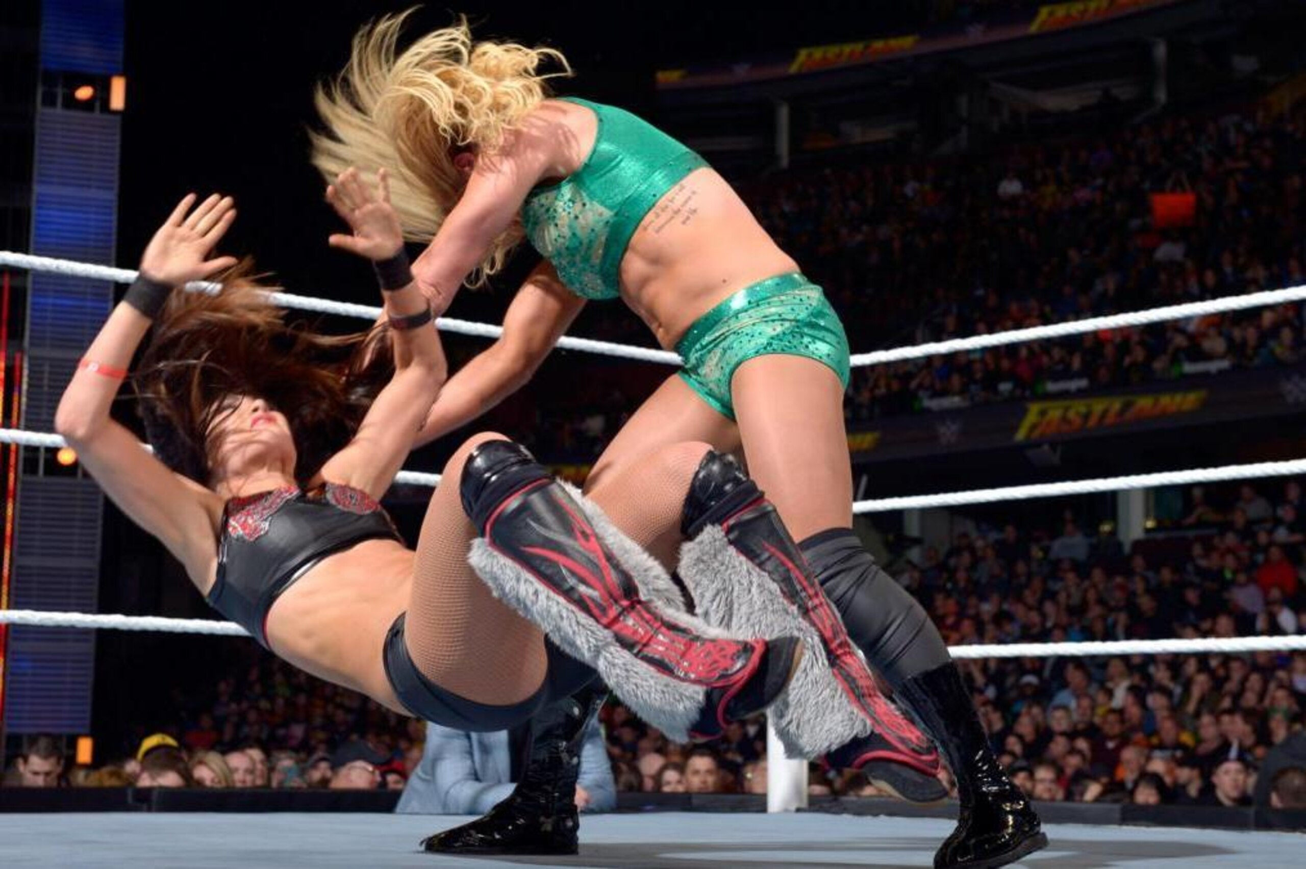 Charlotte knocks over Brie Bella at Fastlane. Charlotte knocks over Brie Bella at Fastlane.