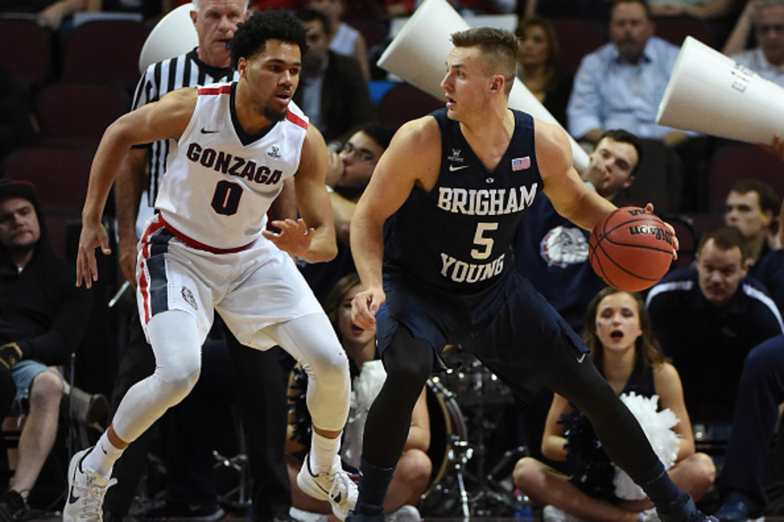 LAS VEGAS, NV - MARCH 07:  Kyle Collinsworth #5 of the Brigham Young Cougars is guarded by Silas Melson #0 of the Gonzaga Bulldogs during a semifinal game of the West Coast Conference Basketball tournament at the Orleans Arena on March 7, 2016 in Las Vega