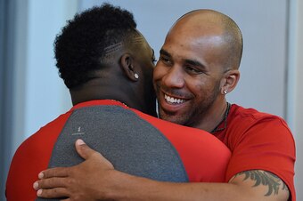 FT. MYERS, FL - FEBRUARY  22:   David Price #24 of the Boston Red Sox hugs David Ortiz #34 upon his arrival in the clubhouse on February 22, 2016  at Fenway South in Fort Myers, Florida . (Photo by Michael Ivins/Boston Red Sox/Getty Images)