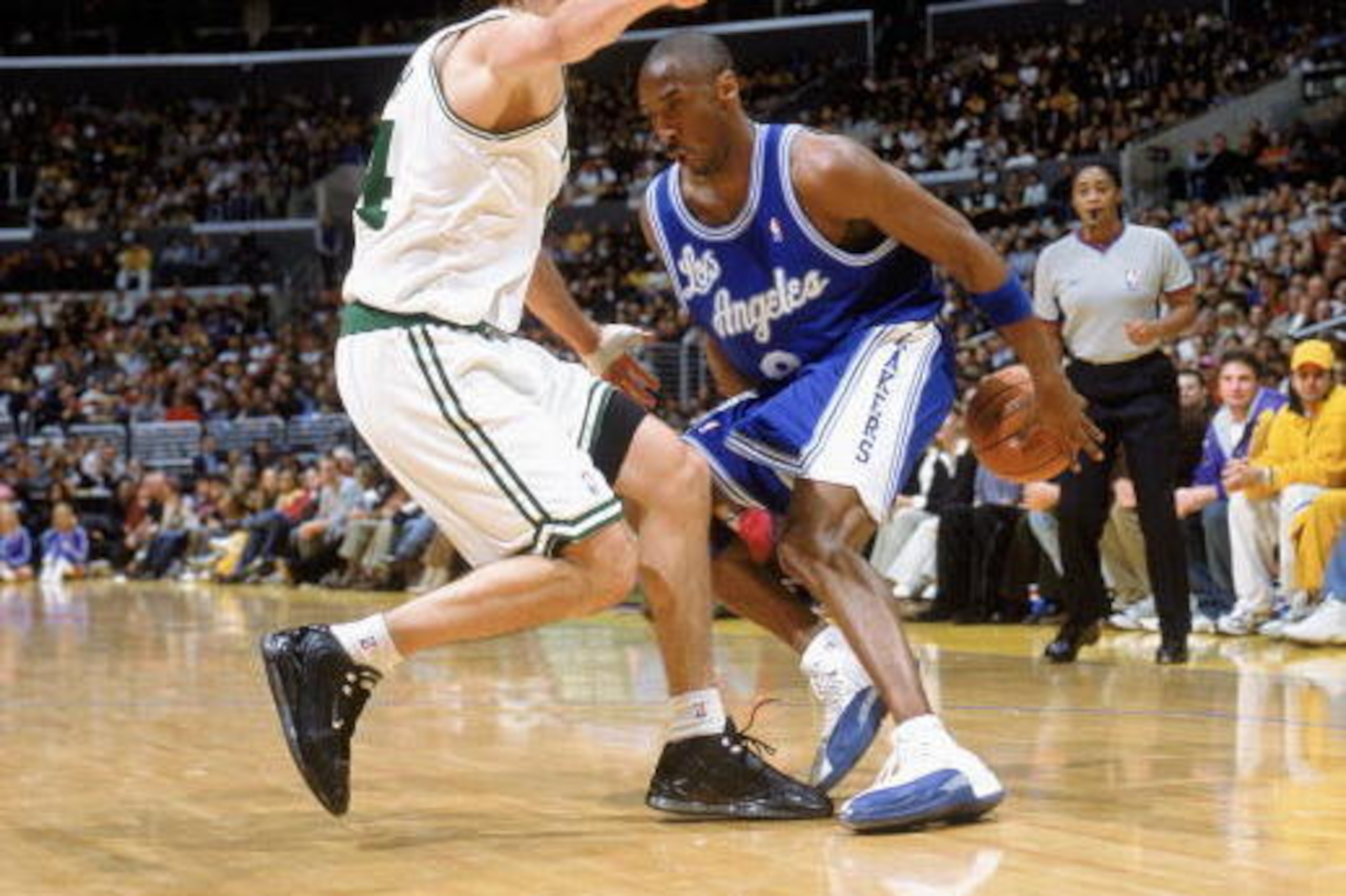 LOS ANGELES - DECEMBER 28:  Kobe Bryant #8 of the Los Angeles Lakers moves the ball as he is covered by Jiri Welsch #44 of the Boston Celtics during the game on December 28, 2003 in the Staples Center in Los Angeles, California. The Lakers won 105-82. NOT