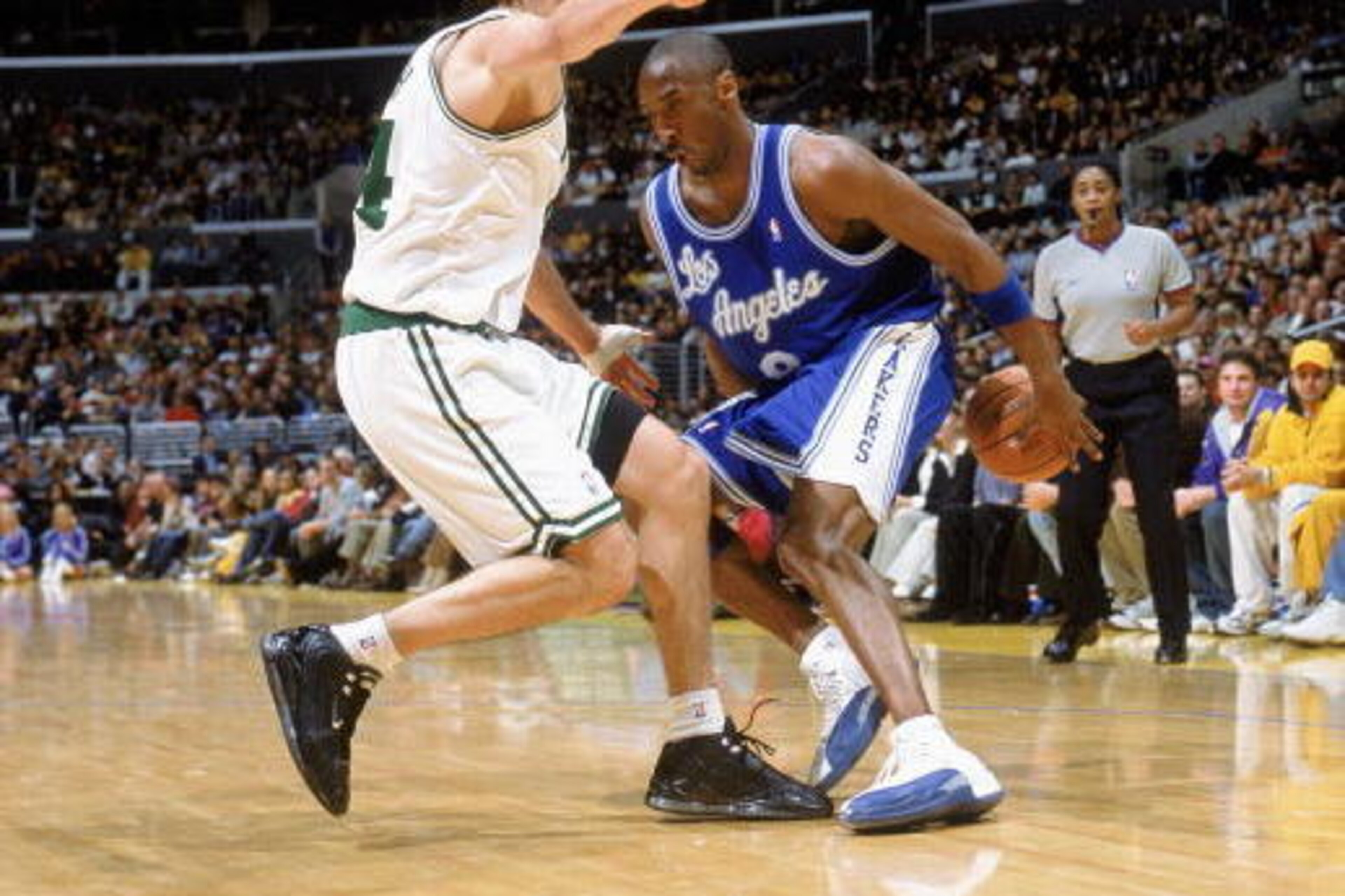 LOS ANGELES - DECEMBER 28:  Kobe Bryant #8 of the Los Angeles Lakers moves the ball as he is covered by Jiri Welsch #44 of the Boston Celtics during the game on December 28, 2003 in the Staples Center in Los Angeles, California. The Lakers won 105-82. NOT