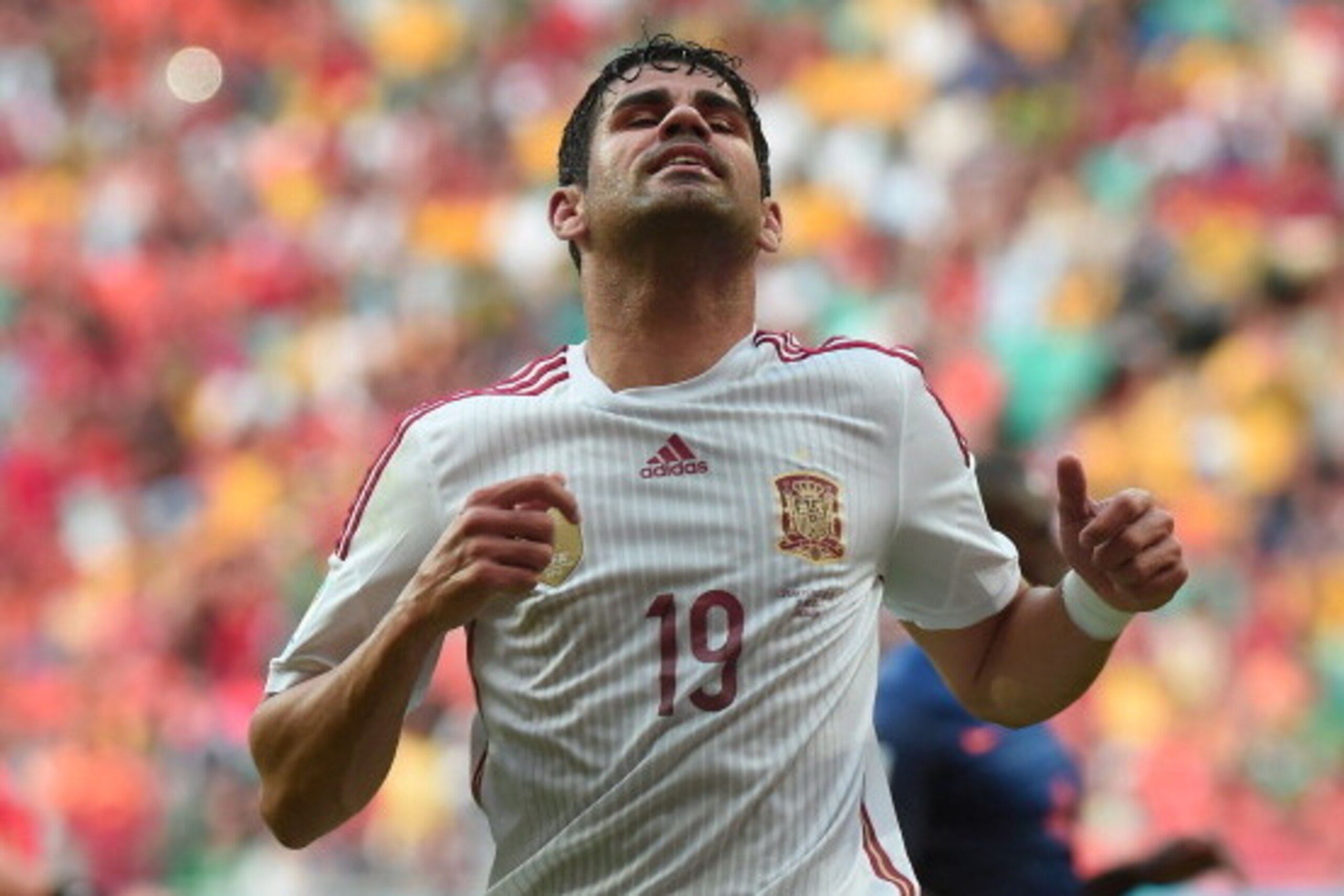 Spain's forward Diego Costa reacts during a Group B football match between Spain and the Netherlands at the Fonte Nova Arena in Salvador during the 2014 FIFA World Cup on June 13, 2014.    AFP PHOTO / DAMIEN MEYER        (Photo credit should read DAMIEN M