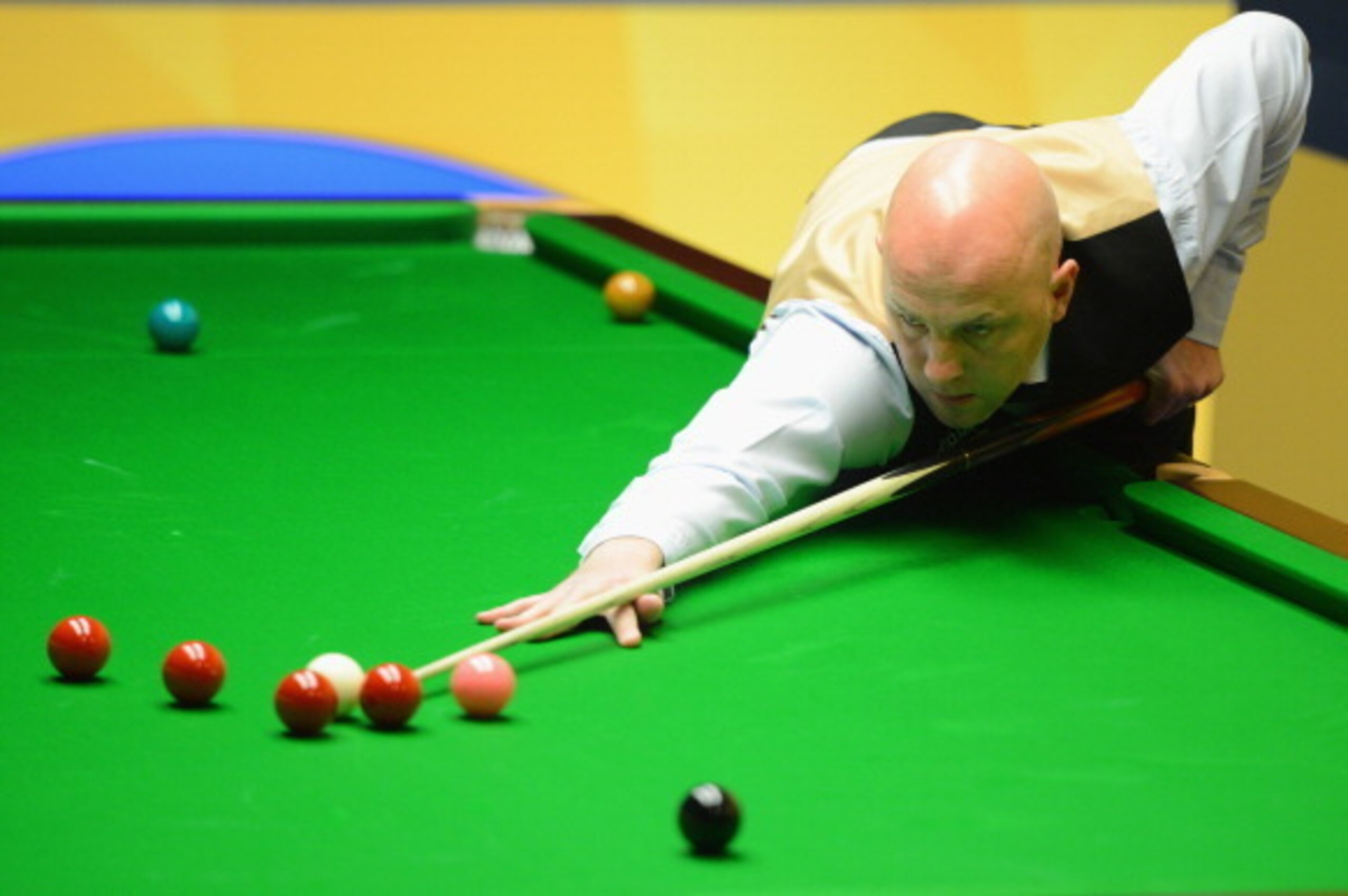 SHEFFIELD, ENGLAND - APRIL 29:  Mark King of England plays a shot in his match against Ding Junhui of China during the Betfair World Snooker Championship at the Crucible Theatre on April 29, 2013 in Sheffield, England.  (Photo by Michael Regan/Getty Image