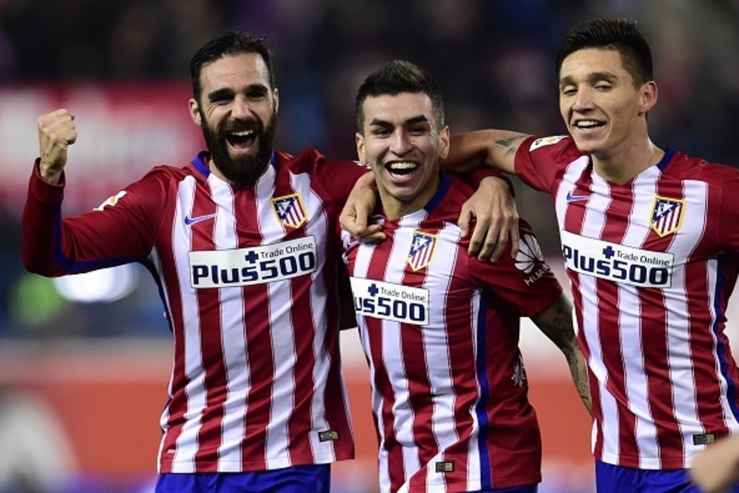 Atletico Madrid's Argentinian midfielder Angel Correa (C) celebrates a goal with Atletico Madrid's Argentinian midfielder Matias Kranevitter (R) and Atletico Madrid's defender Jesus Gamez during the Spanish Copa del Rey (King's Cup) round of 16 second leg