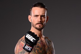 DALLAS, TX - MARCH 13:  Phil 'CM Punk' Brooks poses for a photo during a UFC photo session at the Hilton Anatole Hotel on March 13, 2015 in Dallas, Texas. (Photo by Mike Roach/Zuffa LLC/Zuffa LLC via Getty Images)