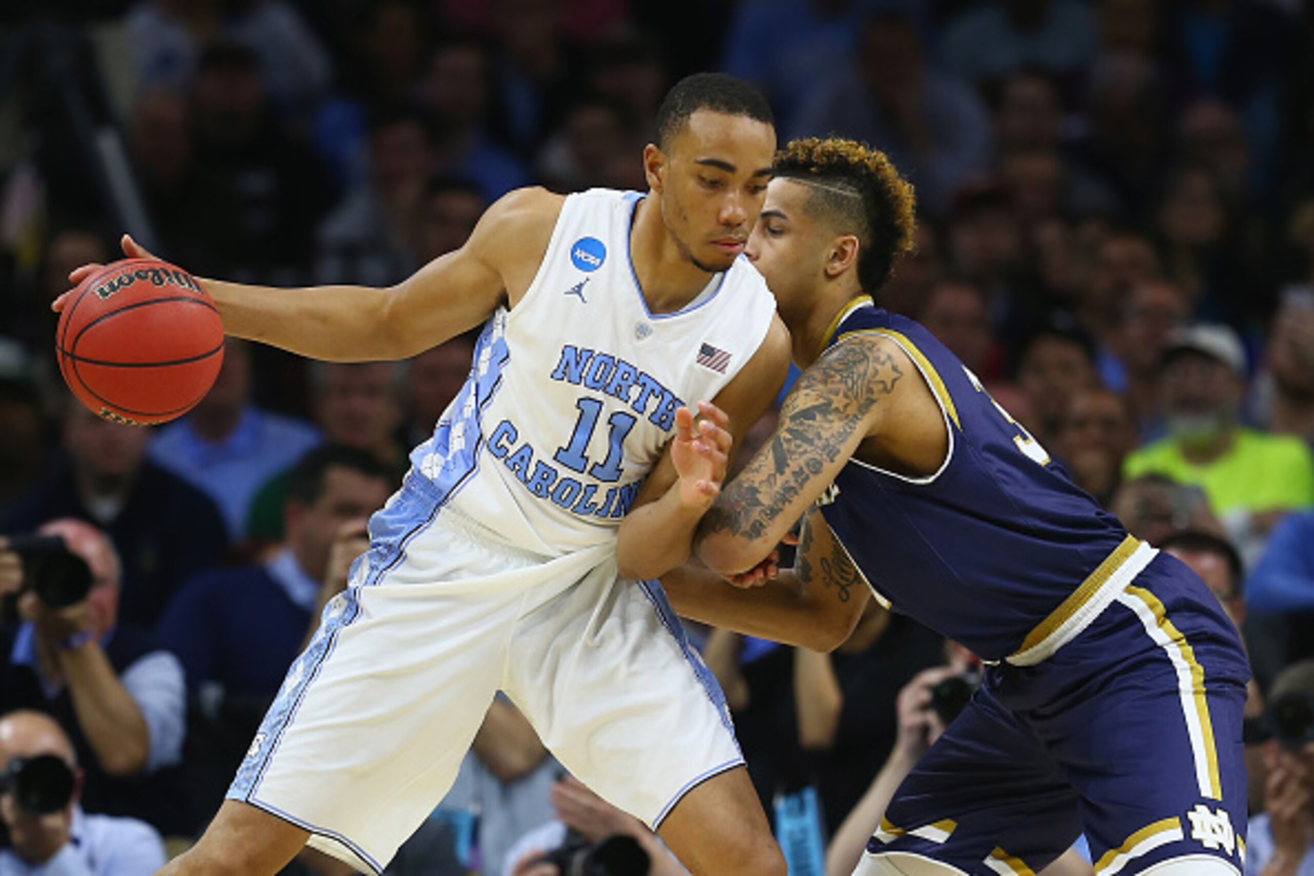 PHILADELPHIA, PA - MARCH 27:  Brice Johnson #11 of the North Carolina Tar Heels drives to the basket in the second half against Zach Auguste #30 of the Notre Dame Fighting Irish during the 2016 NCAA Men's Basketball Tournament East Regional Final at Wells