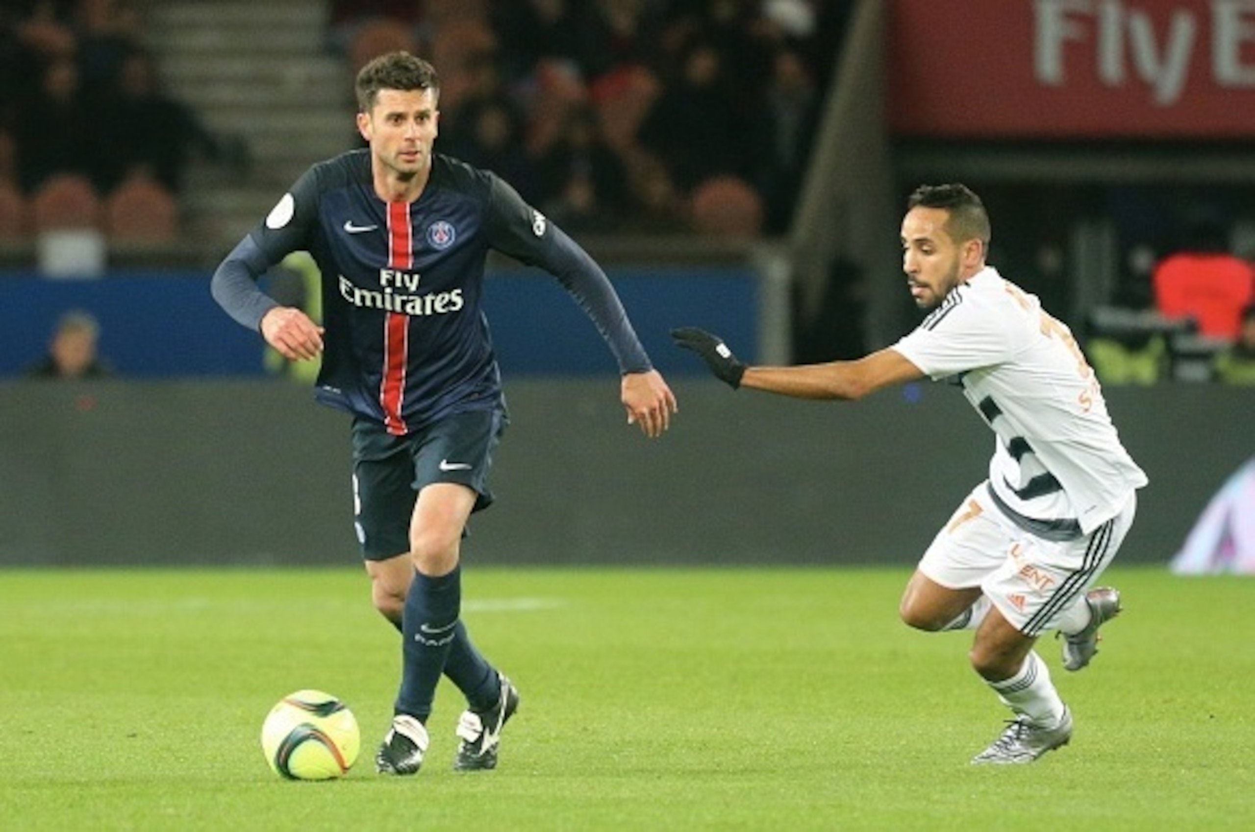 PARIS, FRANCE - FEBRUARY 03: Thiago Motta of Paris Saint-Germain in action with Walid Mesloub of FC Lorient during the French Ligue 1 between Paris Saint-Germain and FC Lorient at Parc Des Princes on february 3, 2016 in Paris, France. (Photo by Xavier Lai