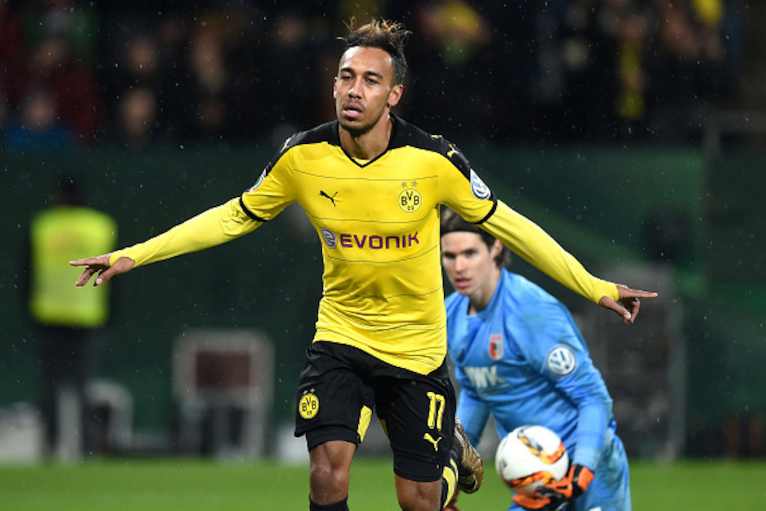 Dortmund's Gabonese striker Pierre-Emerick Aubameyang (L) celebrates after his goal beside Augsburg's Swiss goalkeeper Marwin Hitz during the German Cup DFB Pokal third round match between Borussia Dortmund and FC Augsburg in Augsburg on December 16, 2015