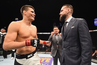 LAS VEGAS, NV - FEBRUARY 06:  (R-L) Phil 'CM Punk' Brooks faces off with Mickey Gall after Gall's victory over Mike Jackson during the UFC Fight Night event at MGM Grand Garden Arena on February 6, 2016 in Las Vegas, Nevada.  (Photo by Jeff Bottari/Zuffa 