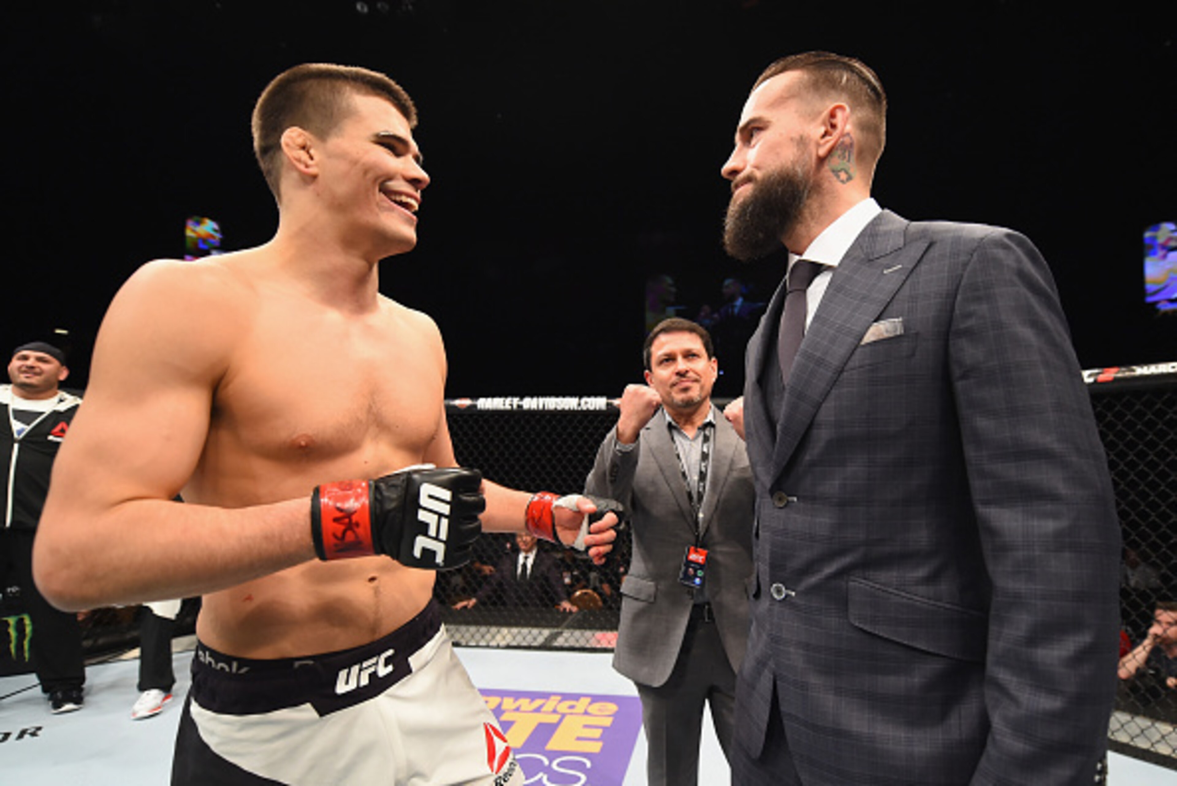 LAS VEGAS, NV - FEBRUARY 06: (R-L) Phil 'CM Punk' Brooks faces off with Mickey Gall after Gall's victory over Mike Jackson during the UFC Fight Night event at MGM Grand Garden Arena on February 6, 2016 in Las Vegas, Nevada. (Photo by Jeff Bottari/Zuffa LAS VEGAS, NV - FEBRUARY 06: (R-L) Phil 'CM Punk' Brooks faces off with Mickey Gall after Gall's victory over Mike Jackson during the UFC Fight Night event at MGM Grand Garden Arena on February 6, 2016 in Las Vegas, Nevada. (Photo by Jeff Bottari/Zuffa