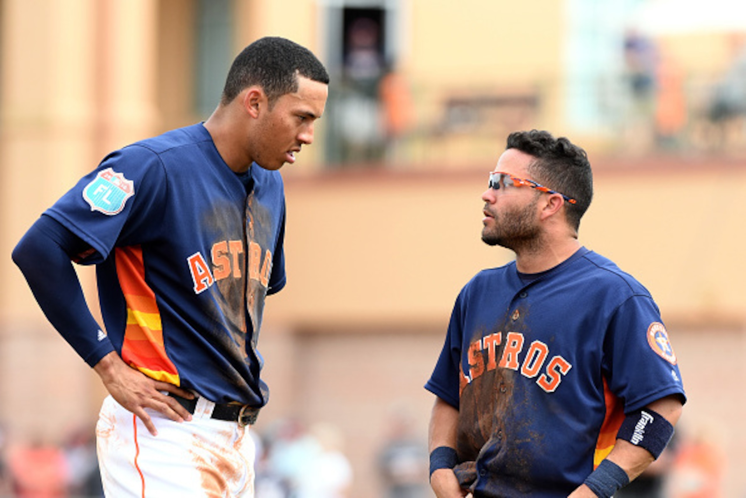 KISSIMMEE, FL - MARCH 11:  Jose Altuve #27 (R) and Carlos Correa #1 of the Houston Astros stand together on the field during the Spring Training game against the Detroit Tigers at Osceola County Stadium on March 11, 2016 in Kissimmee, Florida. The Astros
