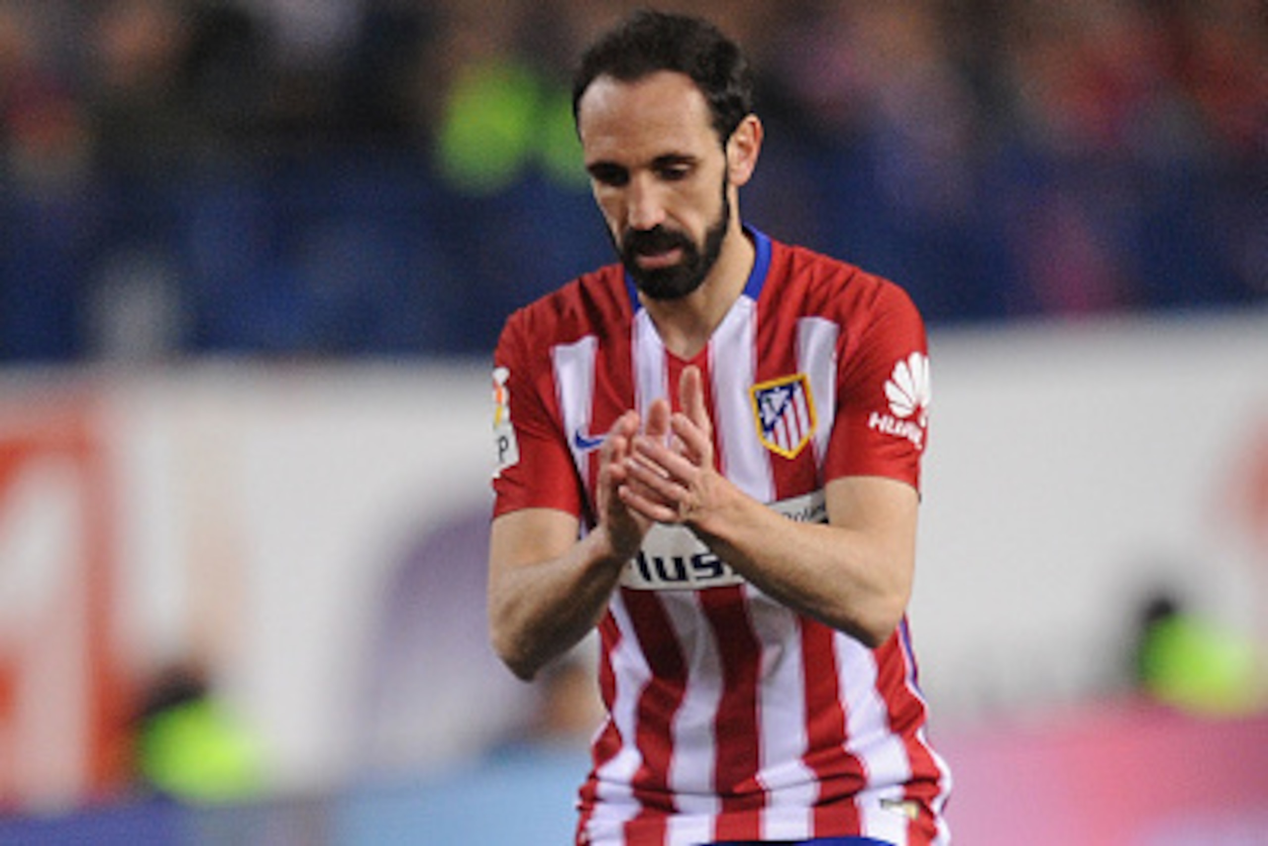 MADRID, SPAIN - FEBRUARY 21:  Juanfran of Club Atletico de Madrid reacts during the La Liga match between Club Atletico de Madrid and Villarreal CF at Vicente Calderon Stadium on February 21, 2016 in Madrid, Spain.  (Photo by Denis Doyle/Getty Images)