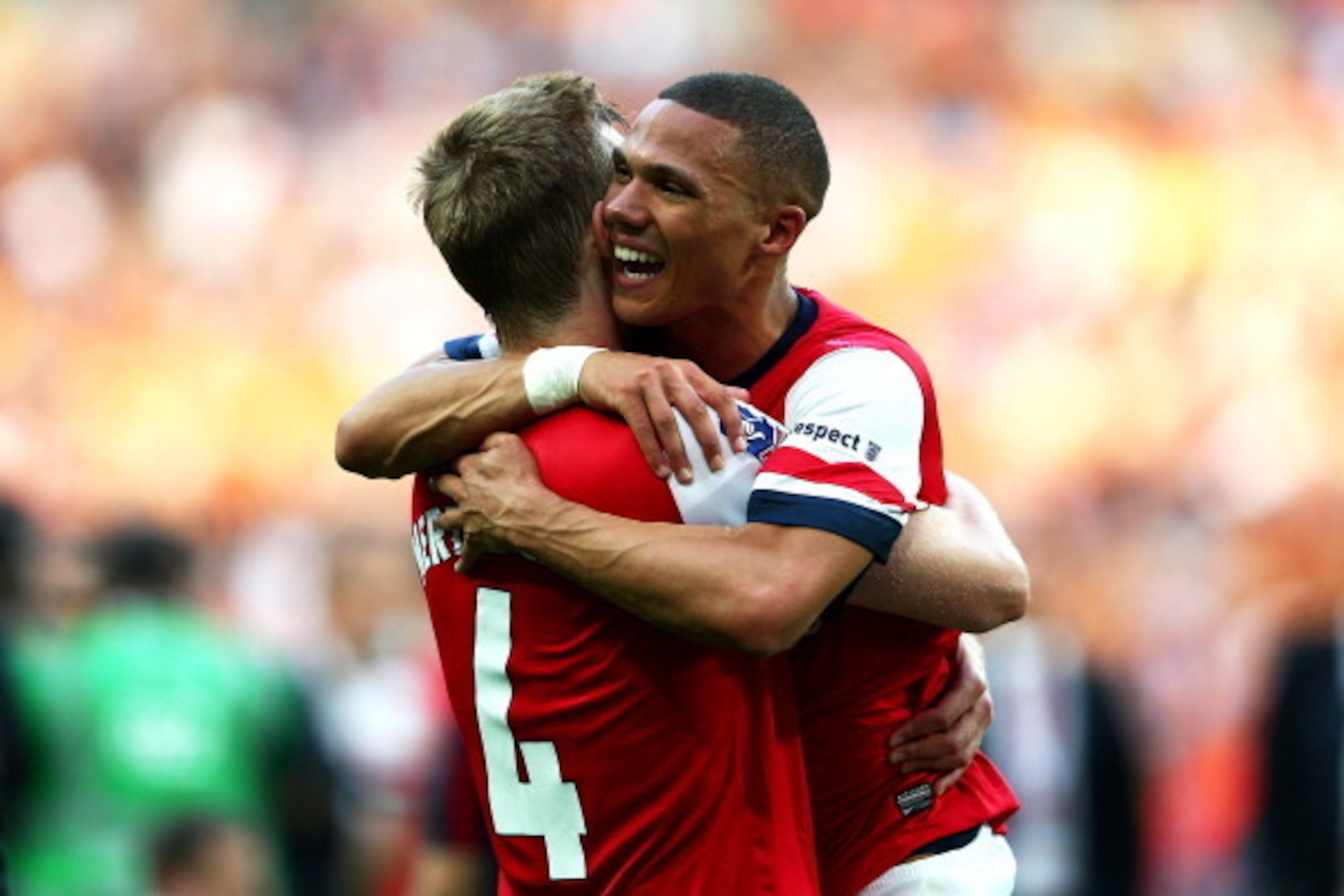 LONDON, ENGLAND - MAY 17:  Per Mertesacker (L) and Kieran Gibbs of Arsenal celebrate victory after the FA Cup with Budweiser Final match between Arsenal and Hull City at Wembley Stadium on May 17, 2014 in London, England.  (Photo by Clive Mason/Getty Imag