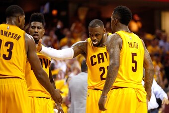 CLEVELAND, OH - MAY 26: LeBron James #23 of the Cleveland Cavaliers reacts after a play in the third quarter with Tristan Thompson #13, Iman Shumpert #4 and J.R. Smith #5 against the Atlanta Hawks during Game Four of the Eastern Conference Finals of the 2