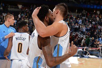 DENVER, CO - NOVEMBER 13:  Will Barton #5 and Danilo Gallinari #8 of the Denver Nuggets hug after the game against the Houston Rockets on November 13, 2015 at the Pepsi Center in Denver, Colorado. NOTE TO USER: User expressly acknowledges and agrees that,