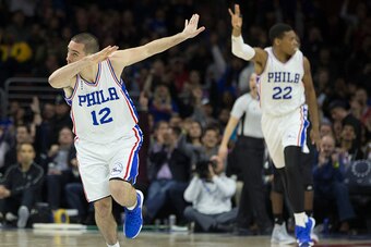 PHILADELPHIA, PA - JANUARY 4: T.J. McConnell #12 and Richaun Holmes #22 of the Philadelphia 76ers react after a made basket in the game against the Minnesota Timberwolves on January 4, 2016 at the Wells Fargo Center in Philadelphia, Pennsylvania. The 76er