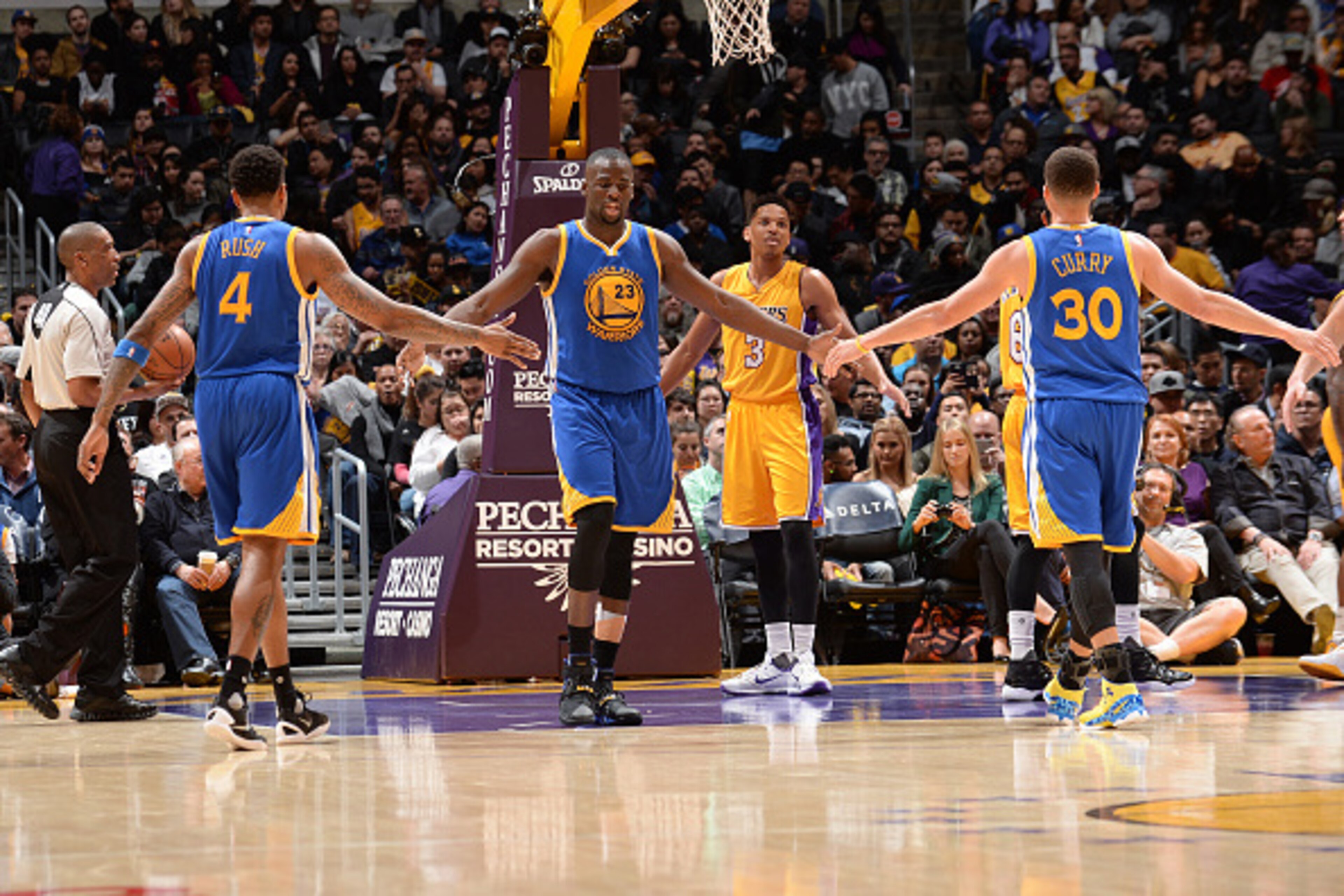 LOS ANGELES, CA - JANUARY 05: Draymond Green #23 of the Golden State Warriors high fives Brandon Rush #4 and Stephen Curry #30 during the game against the Los Angeles Lakers at STAPLES Center on January 05, 2016 in Los Angeles, California. NOTE TO USER: U