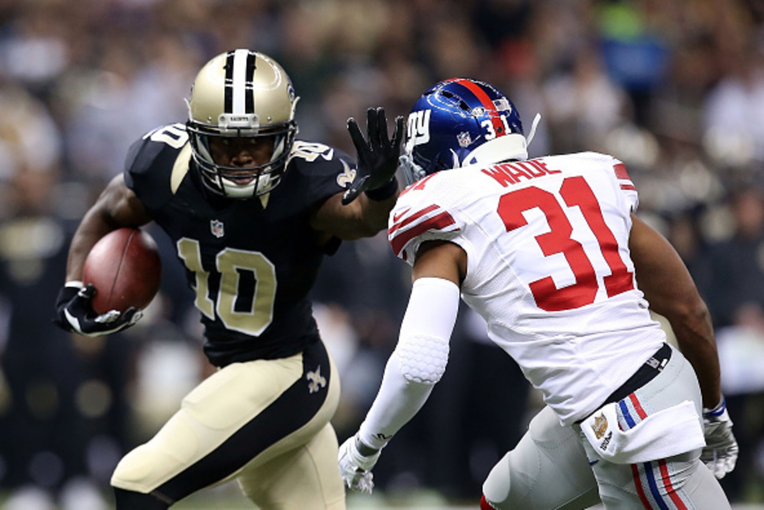NEW ORLEANS, LA - NOVEMBER 01:  Brandin Cooks #10 of the New Orleans Saints avoids a tackle by Trevin Wade #31 of the New York Giants during the first quarter of a game at the Mercedes-Benz Superdome on November 1, 2015 in New Orleans, Louisiana.  (Photo 