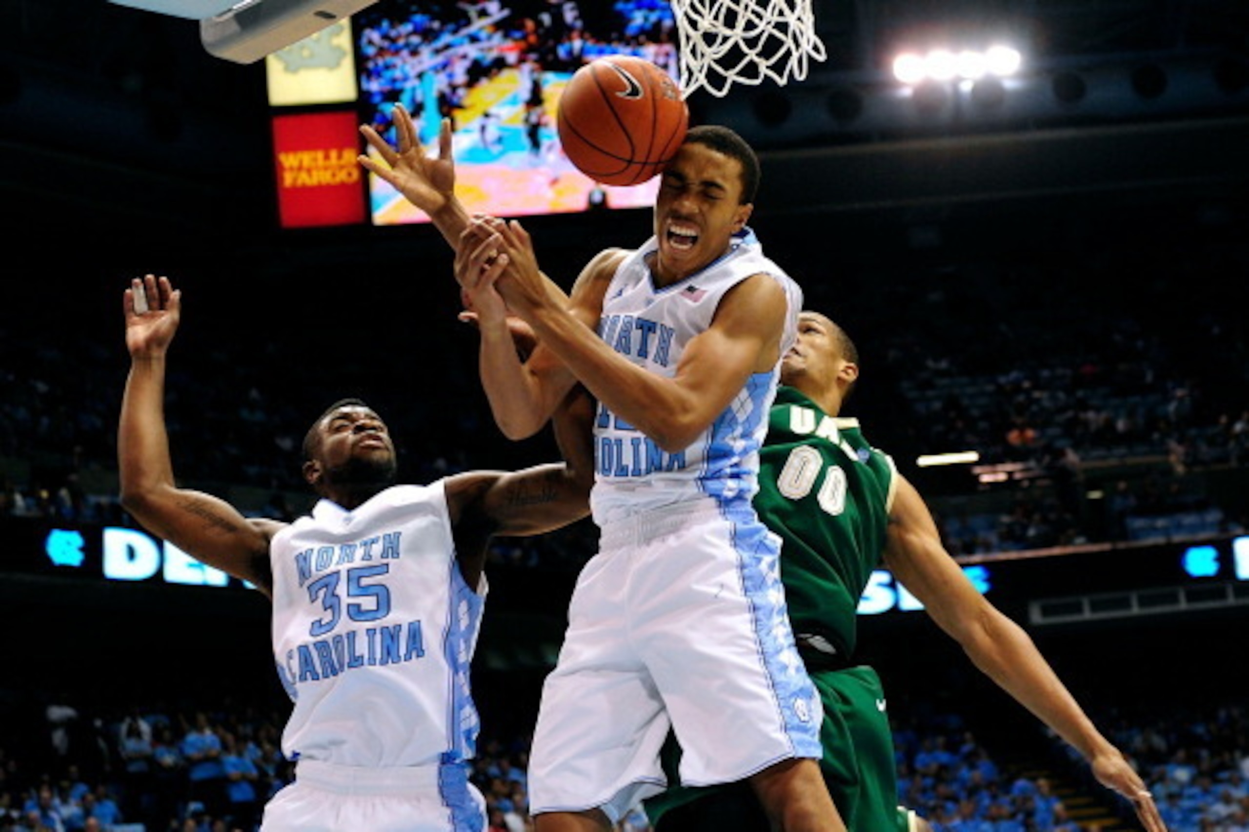 CHAPEL HILL, NC - DECEMBER 01:  Reggie Bullock #35 and Brice Johnson #11 of the North Carolina Tar Heels battle for a rebound with Alexander Scotland-Williams #00 of the UAB Blazers during play at the Dean Smith Center on December 1, 2012 in Chapel Hill, 