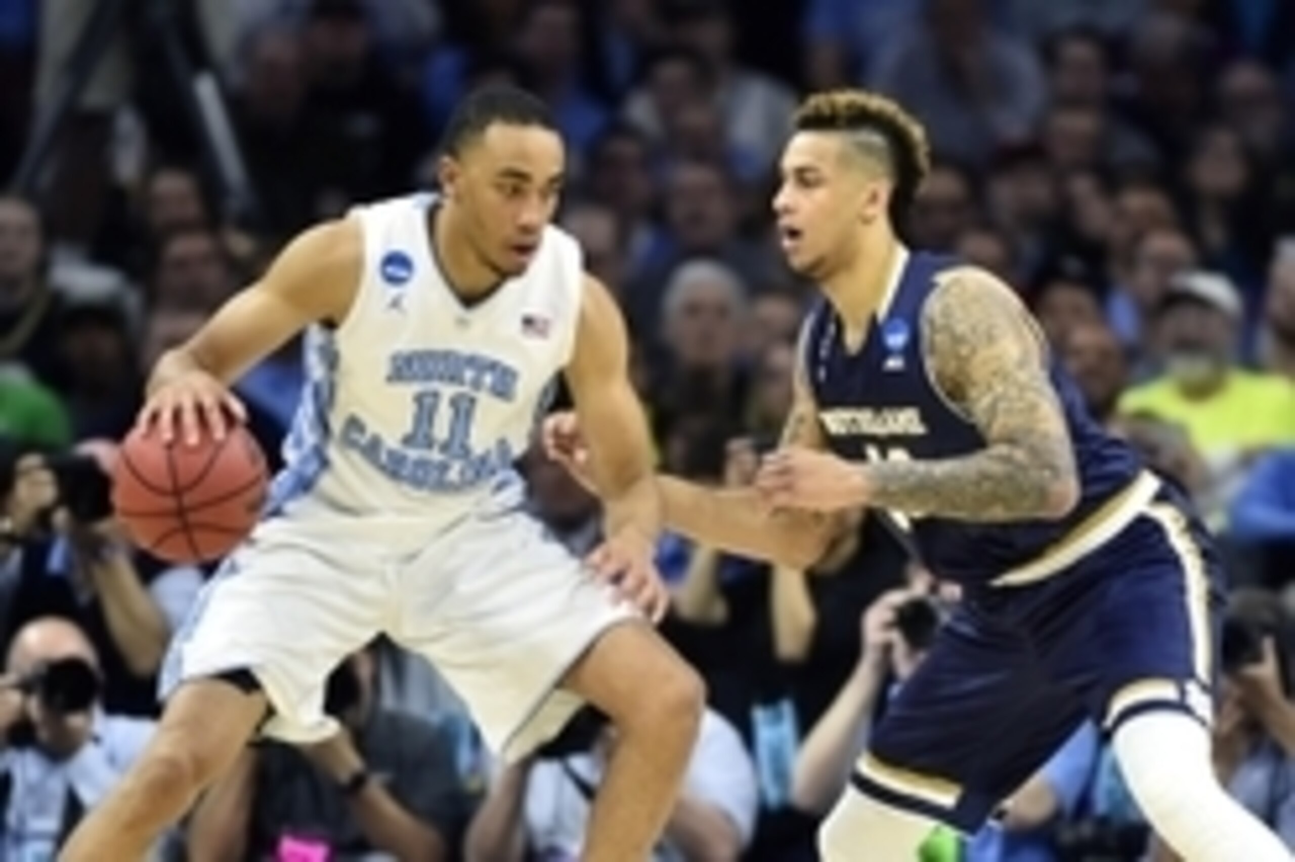 Mar 27, 2016; Philadelphia, PA, USA; North Carolina Tar Heels forward Brice Johnson (11) drives against Notre Dame Fighting Irish forward Zach Auguste (30) during the second half in the championship game in the East regional of the NCAA Tournament at Well