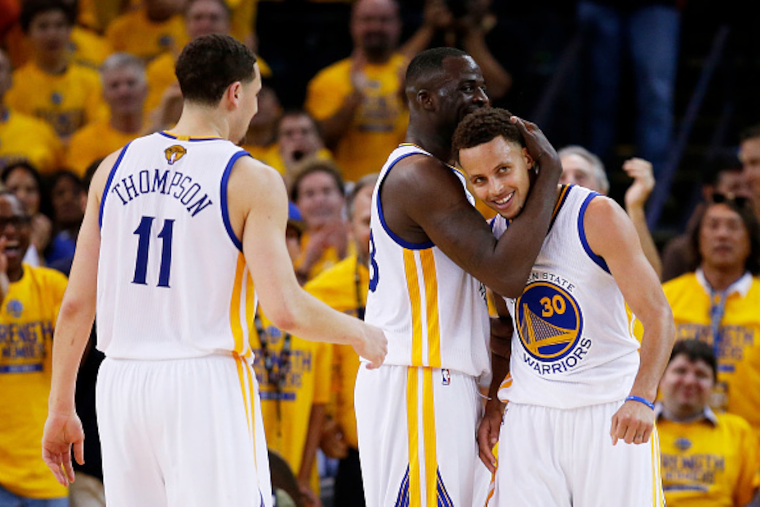 OAKLAND, CA - JUNE 14: Stephen Curry #30 Draymond Green #23 and Klay Thompson #11 of the Golden State Warriors celebrate late in their 109 to 91 win over the Cleveland Cavaliers during Game Five of the 2015 NBA Finals at ORACLE Arena on June 14, 2015 in OAKLAND, CA - JUNE 14: Stephen Curry #30 Draymond Green #23 and Klay Thompson #11 of the Golden State Warriors celebrate late in their 109 to 91 win over the Cleveland Cavaliers during Game Five of the 2015 NBA Finals at ORACLE Arena on June 14, 2015 in