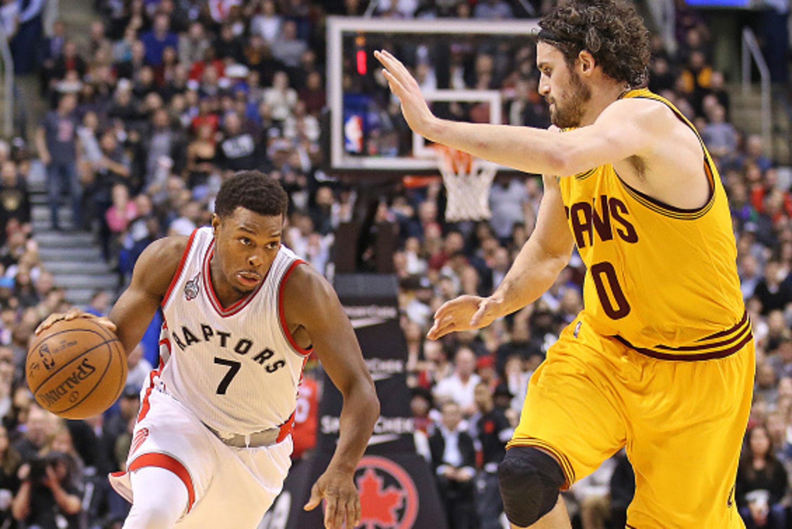 TORONTO, ON - FEBRUARY 26:  Kyle Lowry #7 of the Toronto Raptors drives against Kevin Lowe #0 of the Cleveland Cavaliers during an NBA game at the Air Canada Centre on February 26, 2016 in Toronto, Ontario, Canada. The Raptors defeated the Cavaliers 99-97