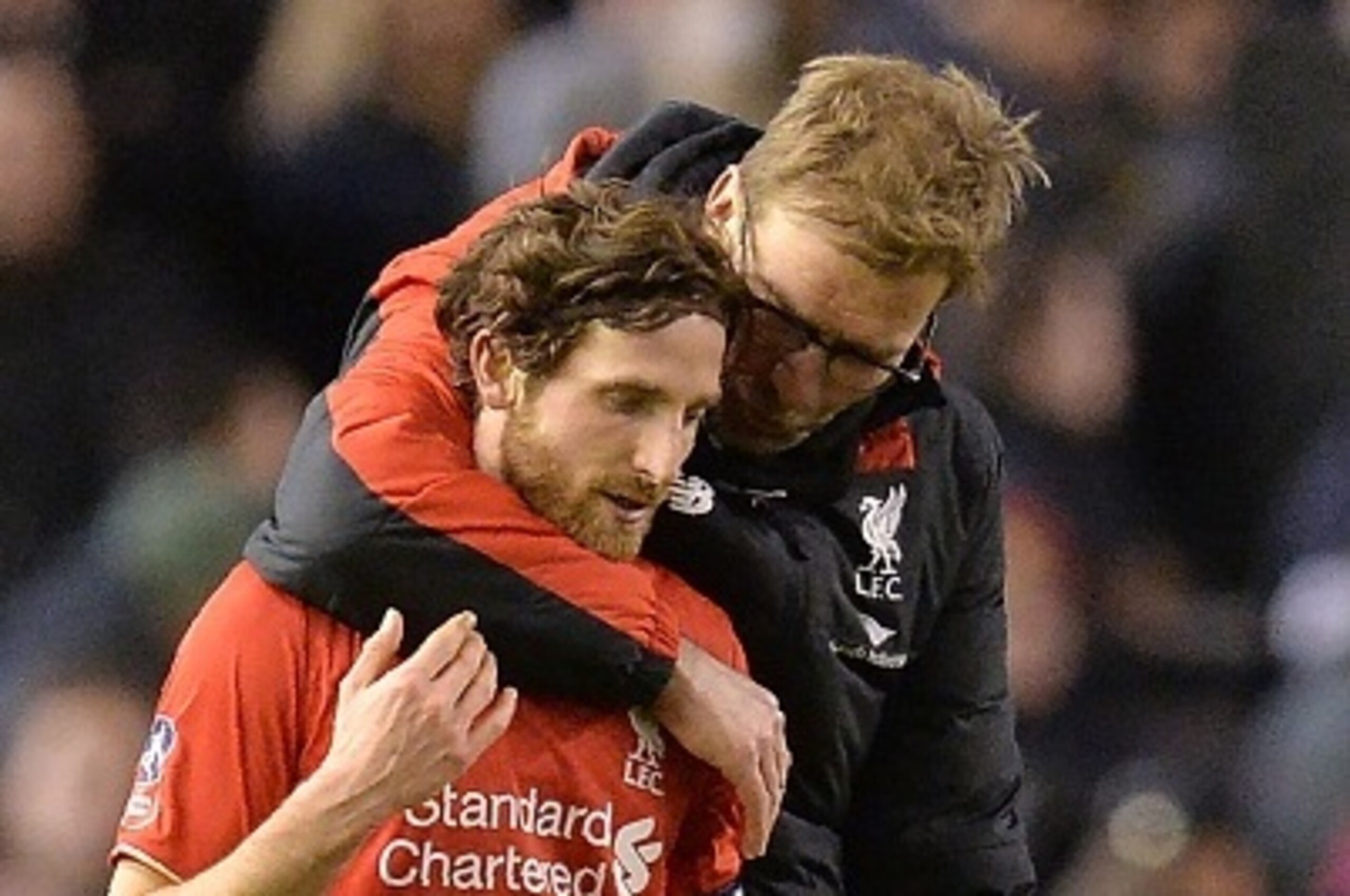 Liverpool's German manager Jurgen Klopp (R) speaks with Liverpool's Welsh midfielder Joe Allen after the end of the English FA Cup fourth round football match between Liverpool and West Ham United at Anfield in Liverpool, north west England, on January 30