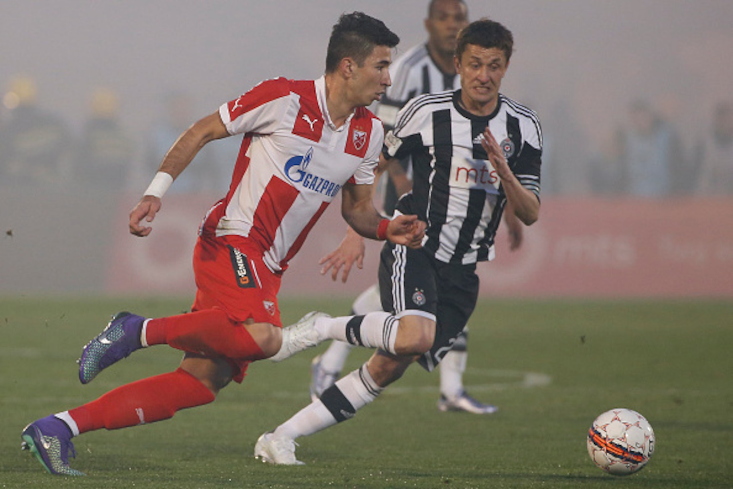 BELGRADE, SERBIA - FEBRUARY 27 : Marko Grujic (L) of FK Crvena Zvezda in action against Sasa Ilic (R) of FK Partizan during the Serbian Super League match between FK Partizan and FK Crvena Zvezda at Stadium FK Partizan on February 27, 2016 in Belgrade, Se