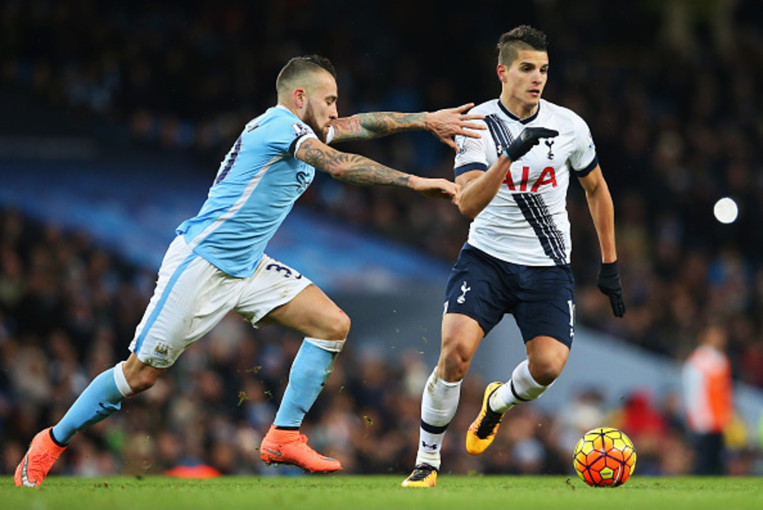 MANCHESTER, ENGLAND - FEBRUARY 14: Erik Lamela of Tottenham Hotspur goes past Nicolas Otamendi of Manchester City during the Barclays Premier League match between Manchester City and Tottenham Hotspur at Etihad Stadium on February 14, 2016 in Manchester, MANCHESTER, ENGLAND - FEBRUARY 14: Erik Lamela of Tottenham Hotspur goes past Nicolas Otamendi of Manchester City during the Barclays Premier League match between Manchester City and Tottenham Hotspur at Etihad Stadium on February 14, 2016 in Manchester,