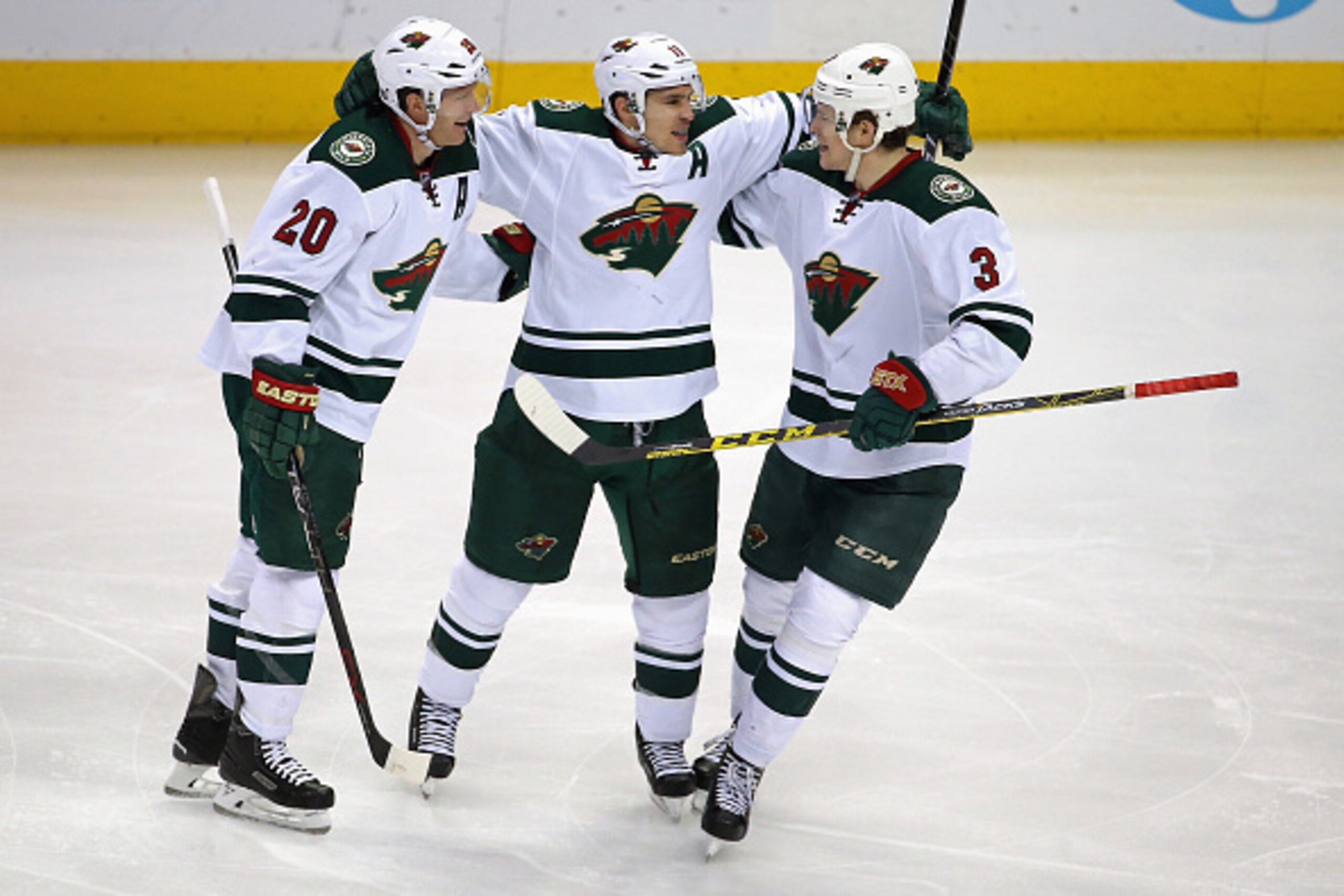 DENVER, CO - MARCH 26:  Zach Parise #11 of the Minnesota Wild celebrates his goal against the Colorado Avalanche to take a 3-0 lead in the third period with teammates Ryan Suter #20 and Charlie Coyle #3 at Pepsi Center on March 26, 2016 in Denver, Colorad