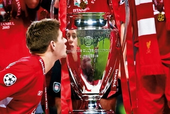 Liverpool captain Steven Gerrard kisses the winner's trophy at the presentation after his side beat AC Milan on penalties at the Champions League Final in the Ataturk Stadium on May 25th 2005 in Istanbul, Turkey (Photo by Tom Jenkins/Getty Images). An ima