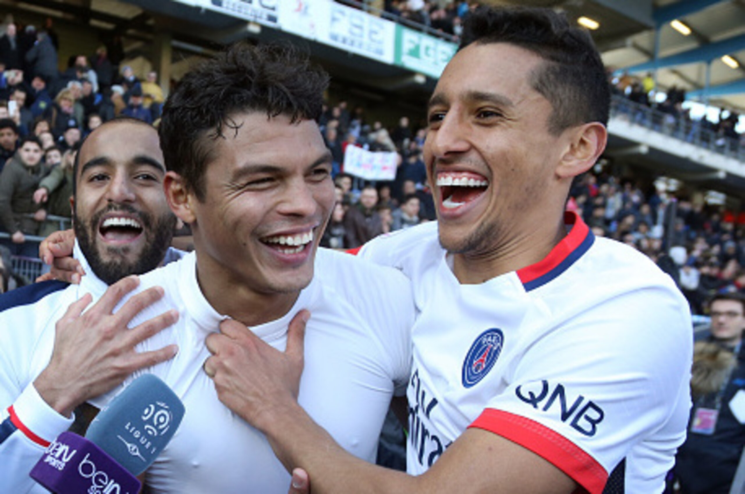 TROYES, FRANCE - MARCH 13: Lucas Moura, Thiago Silva and Marquinhos celebrate winning the French League 1 championships 2015-1016 following the French Ligue 1 match between ESTAC Troyes and Paris Saint-Germain (PSG) at Stade de l'Aube on March 13, 2016 in