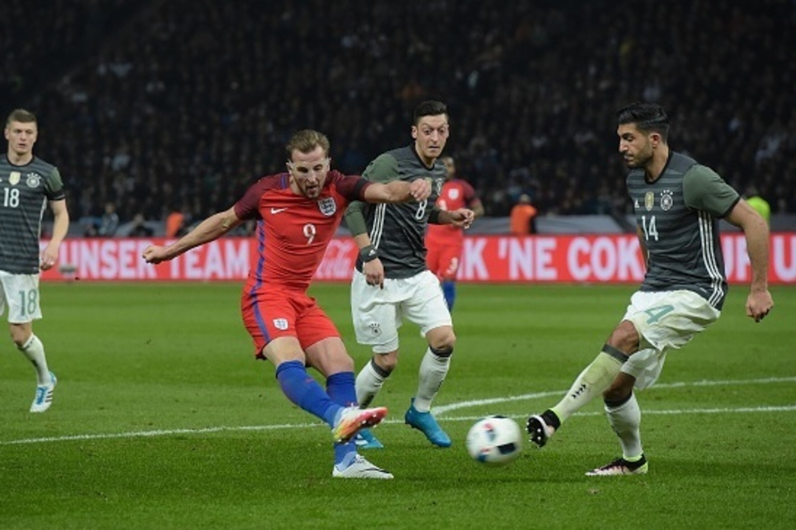 England's striker Harry Kane (2L) shoots past Germany's midfielder Emre Can (R) during the friendly football match Germany v England at the Olympic Stadium in Berlin on March 26, 2016. / AFP / TOBIAS SCHWARZ (Photo credit should read TOBIAS SCHWARZ England's striker Harry Kane (2L) shoots past Germany's midfielder Emre Can (R) during the friendly football match Germany v England at the Olympic Stadium in Berlin on March 26, 2016. / AFP / TOBIAS SCHWARZ (Photo credit should read TOBIAS SCHWARZ