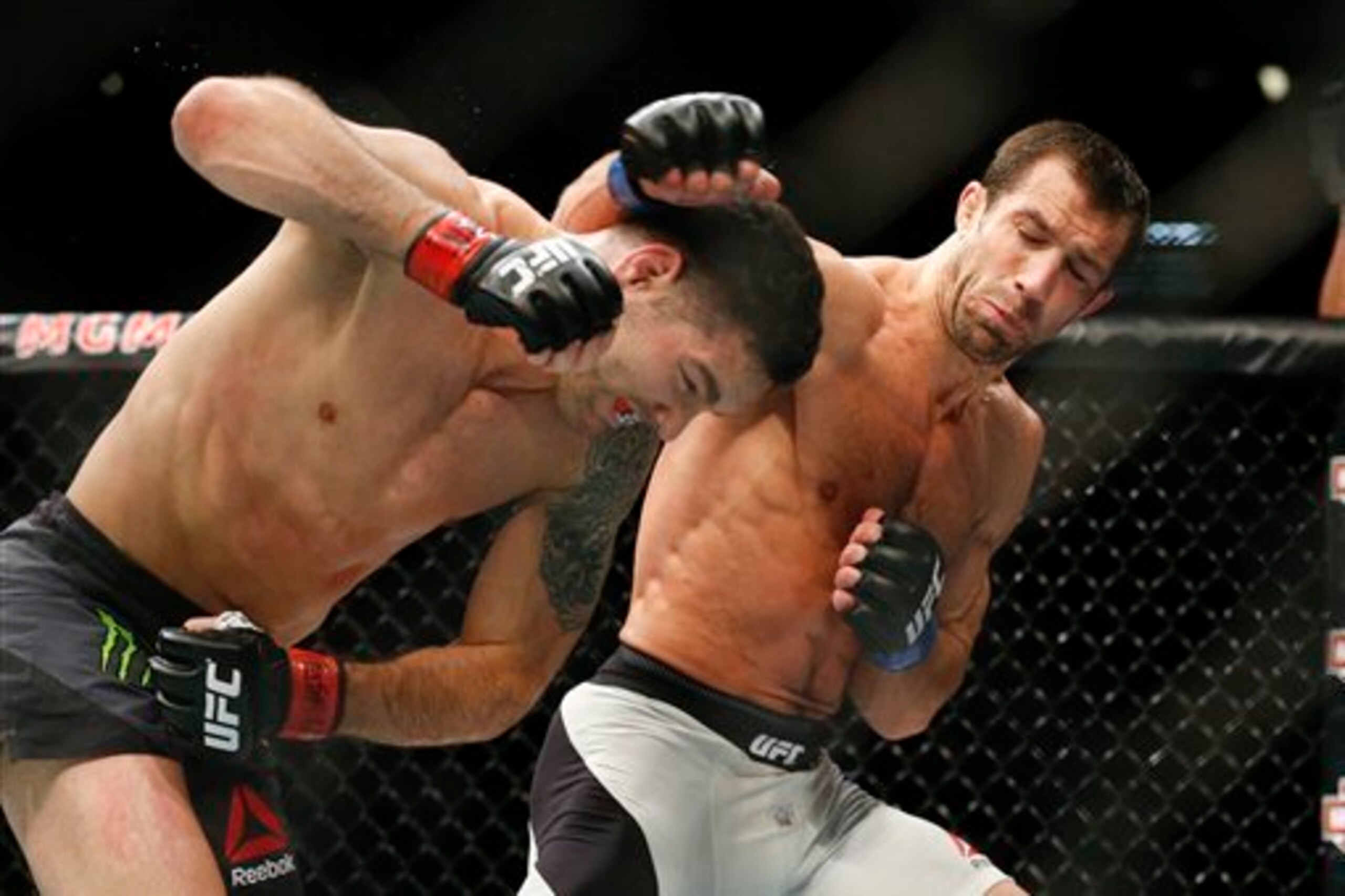 Weidman (left) and Rockhold in their first bout.