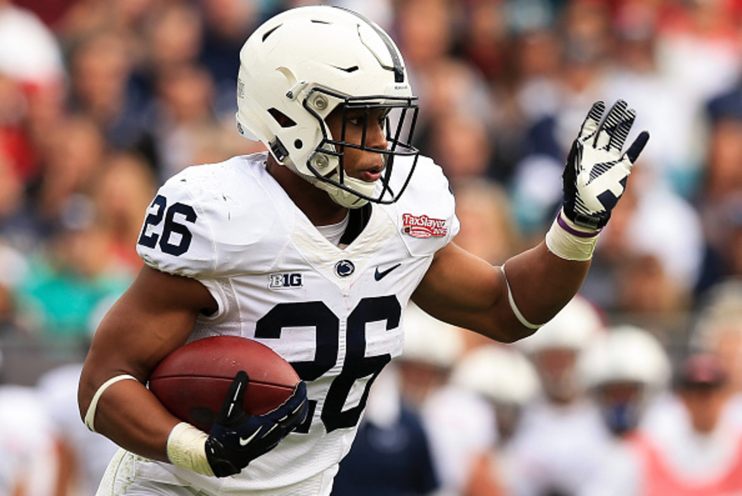 JACKSONVILLE, FL - JANUARY 02: Saquon Barkley #26 of the Penn State Nittany Lions in action during the TaxSlayer Bowl game against the Georgia Bulldogs at EverBank Field on January 2, 2016 in Jacksonville, Florida.  (Photo by Rob Foldy/Getty Images)