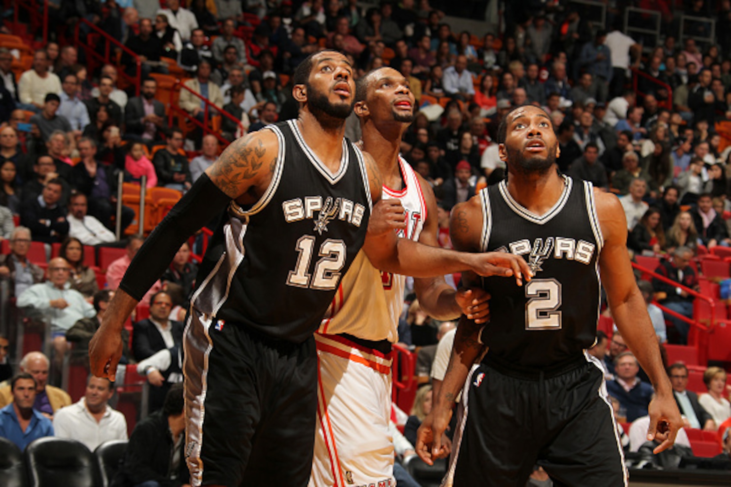 MIAMI, FL - FEBRUARY 9: LaMarcus Aldridge #12 of the San Antonio Spurs and Kawhi Leonard #2 of the San Antonio Spurs boxes out against Chris Bosh #1 of the Miami Heat during the game on February 9, 2016 at American Airlines Arena in Miami, Florida. NOTE MIAMI, FL - FEBRUARY 9: LaMarcus Aldridge #12 of the San Antonio Spurs and Kawhi Leonard #2 of the San Antonio Spurs boxes out against Chris Bosh #1 of the Miami Heat during the game on February 9, 2016 at American Airlines Arena in Miami, Florida. NOTE