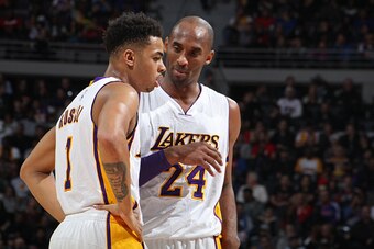 AUBURN HILLS, MI - DECEMBER 6:  Kobe Bryant #24 and D'Angelo Russell #1 of the Los Angeles Lakers talk during the game against the Detroit Pistons on December 6, 2015 at The Palace of Auburn Hills in Auburn Hills, Michigan. NOTE TO USER: User expressly ac