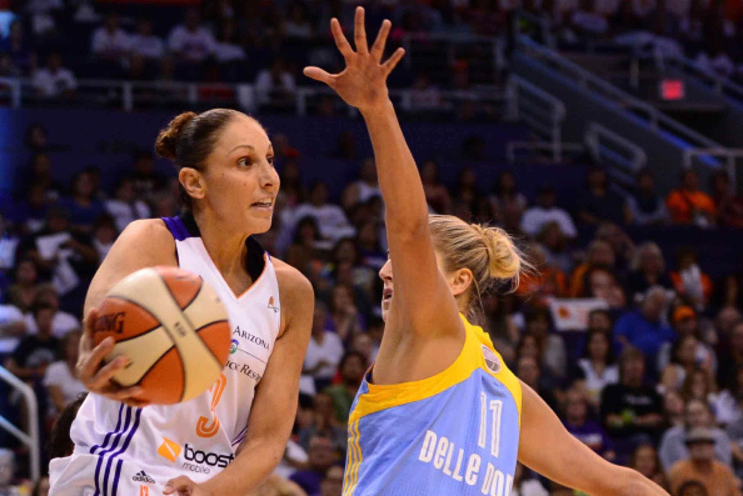 PHOENIX, AZ - SEPTEMBER 07:  Guard Diana Taurasi #3 of the Phoenix Mercury makes a pass against guard Elena Delle Donne #11 of the Chicago Sky in the first half during game one of the WNBA Finals at US Airways Center on September 7, 2014 in Phoenix, Arizo