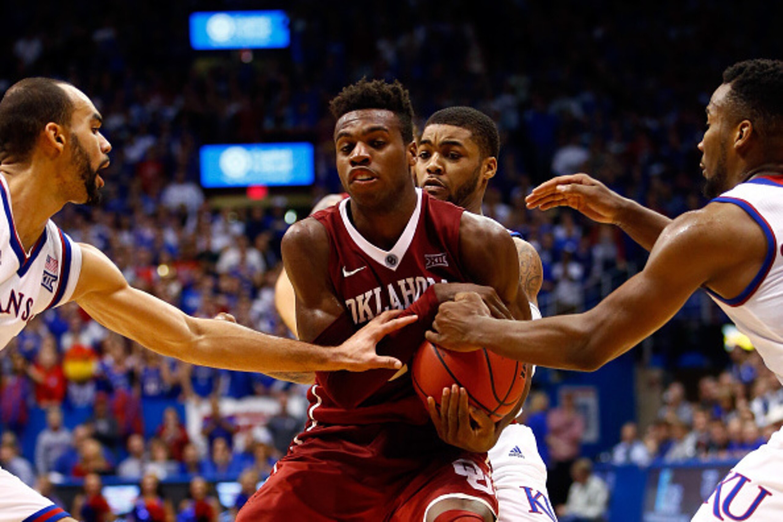 LAWRENCE, KS - JANUARY 04:  Buddy Hield #24 of the Oklahoma Sooners tries to maintain control of the ball during the game against the Kansas Jayhawks at Allen Fieldhouse on January 4, 2016 in Lawrence, Kansas.  (Photo by Jamie Squire/Getty Images)