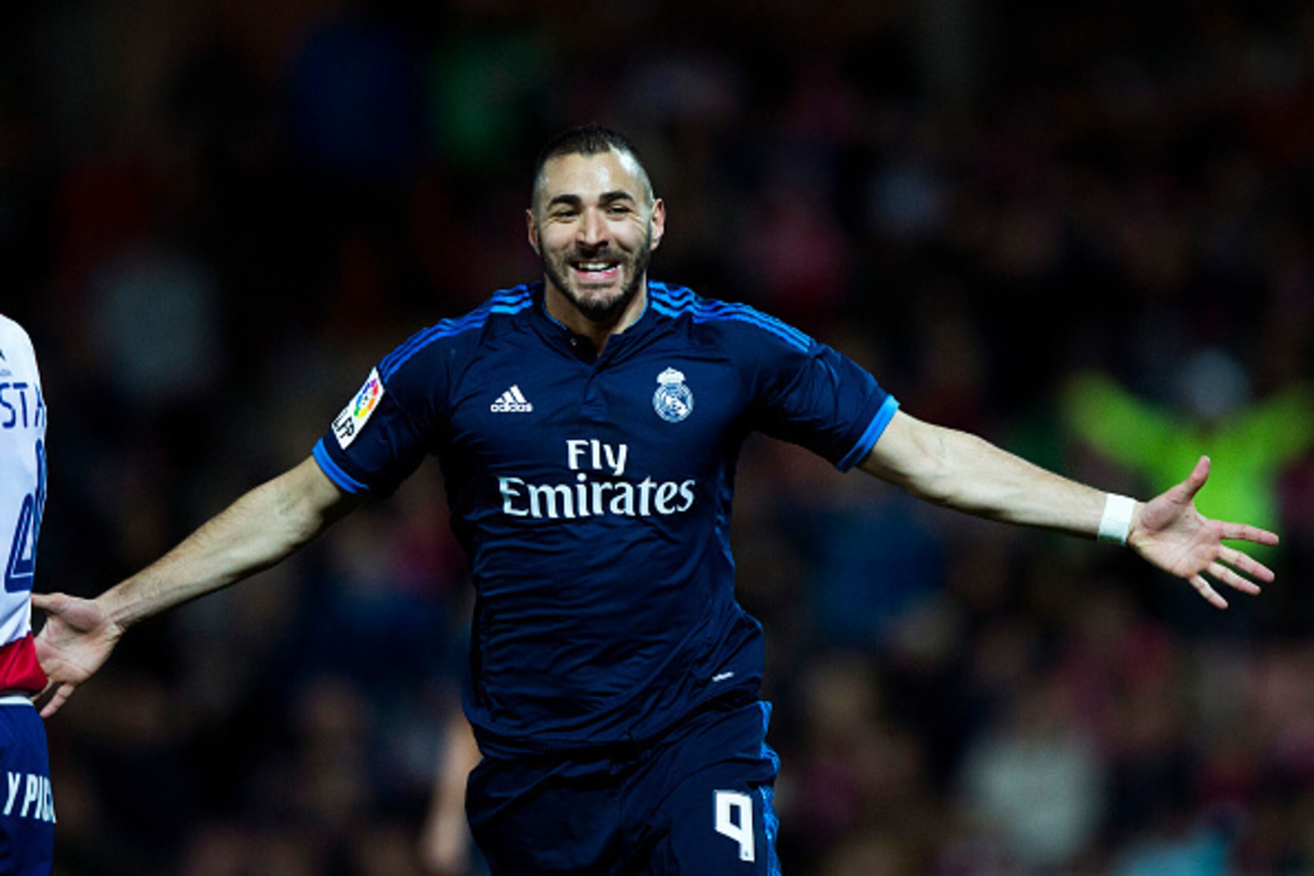 GRANADA, SPAIN - FEBRUARY 07: Karim Benzema of Real Madrid CF celebrates scoring their opening goal during the La Liga match between Granada CF and Real Madrid CF at Estadio Nuevo Los Carmenes on February 7, 2016 in Granada, Spain. (Photo by Gonzalo Arr GRANADA, SPAIN - FEBRUARY 07: Karim Benzema of Real Madrid CF celebrates scoring their opening goal during the La Liga match between Granada CF and Real Madrid CF at Estadio Nuevo Los Carmenes on February 7, 2016 in Granada, Spain. (Photo by Gonzalo Arr