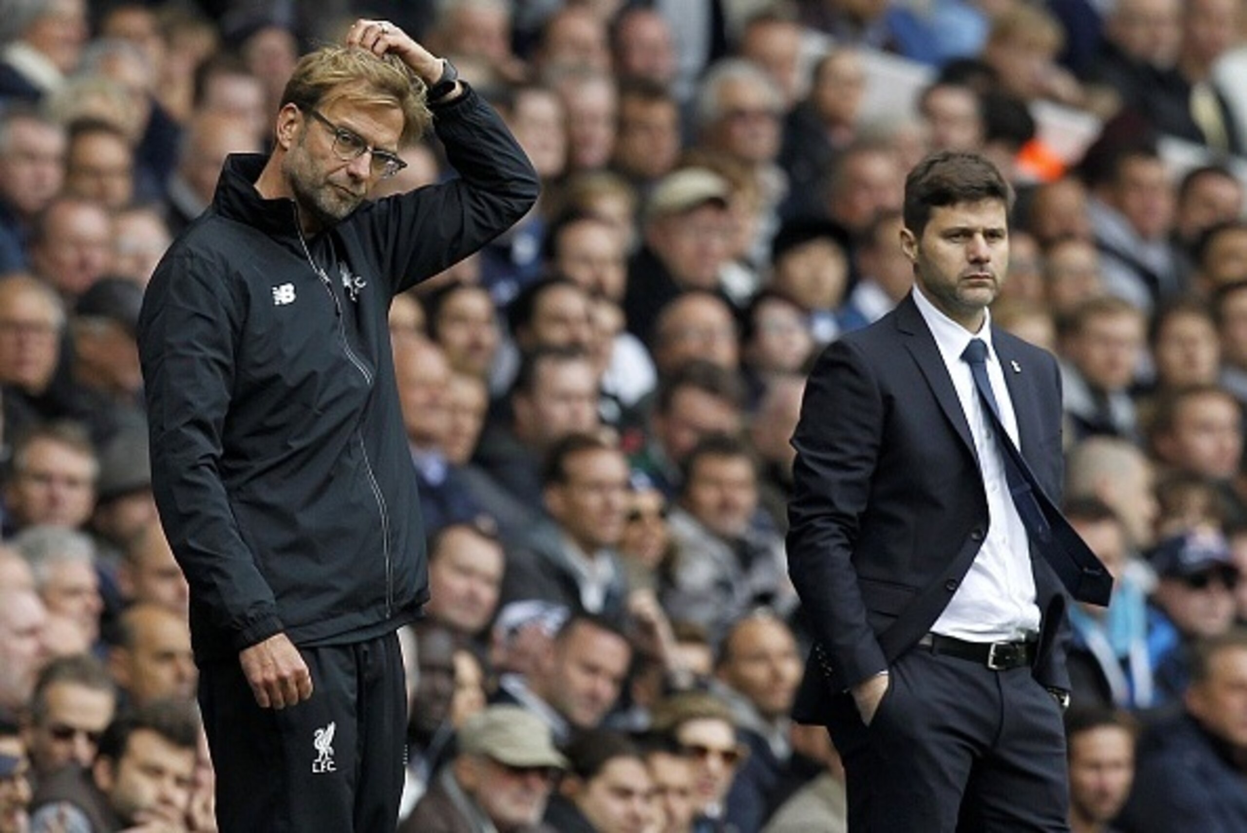 Tottenham Hotspur's Argentinian Head Coach Mauricio Pochettino (R) looks on as Liverpool's German manager Jurgen Klopp (L) gestures during the English Premier League football match between Tottenham Hotspur and Liverpool at White Hart Lane in north London