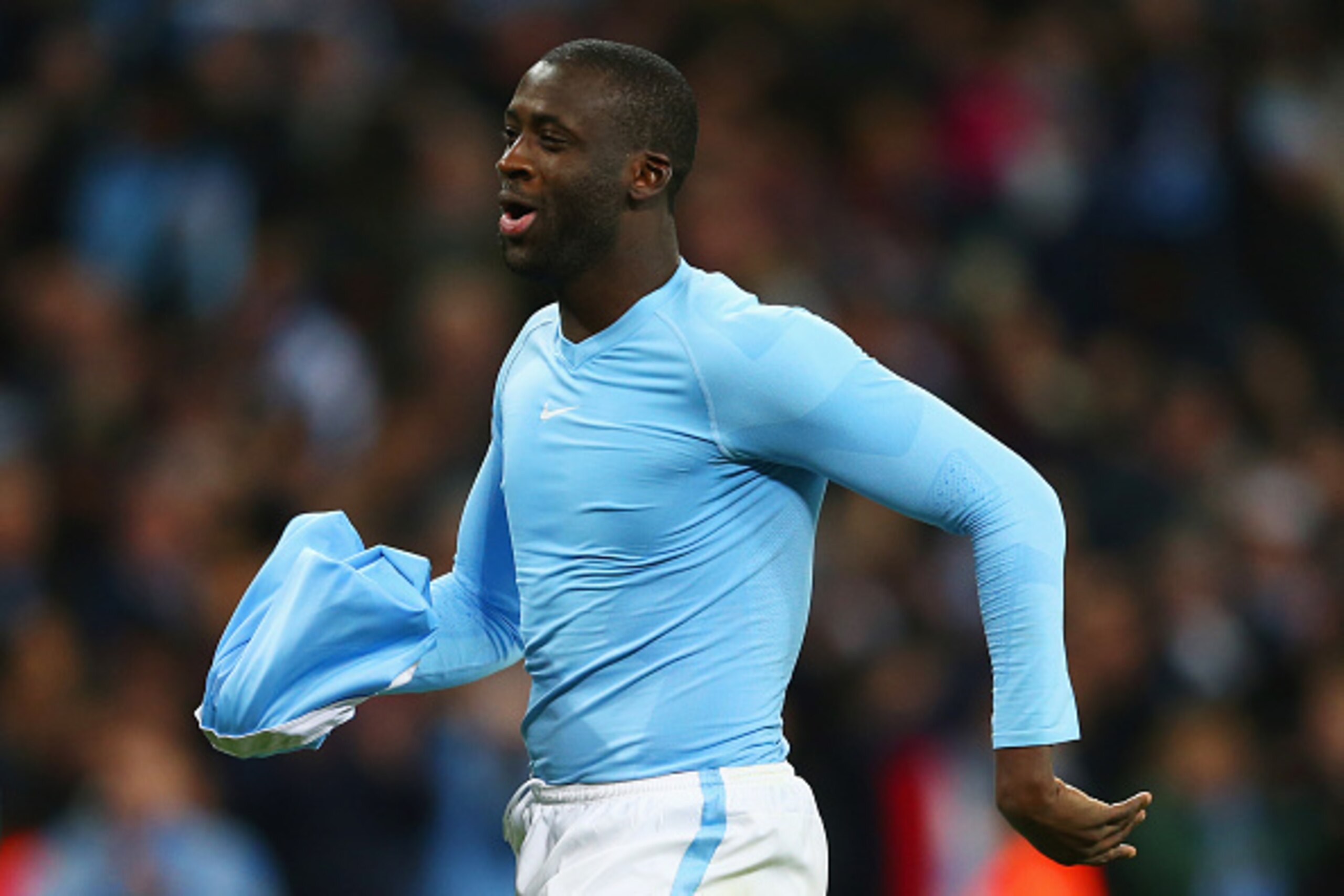 LONDON, ENGLAND - FEBRUARY 28:  Yaya Toure of Manchester City celebrates as he scores the winning penalty to win the shoot out during the Capital One Cup Final match between Liverpool and Manchester City at Wembley Stadium on February 28, 2016 in London, 