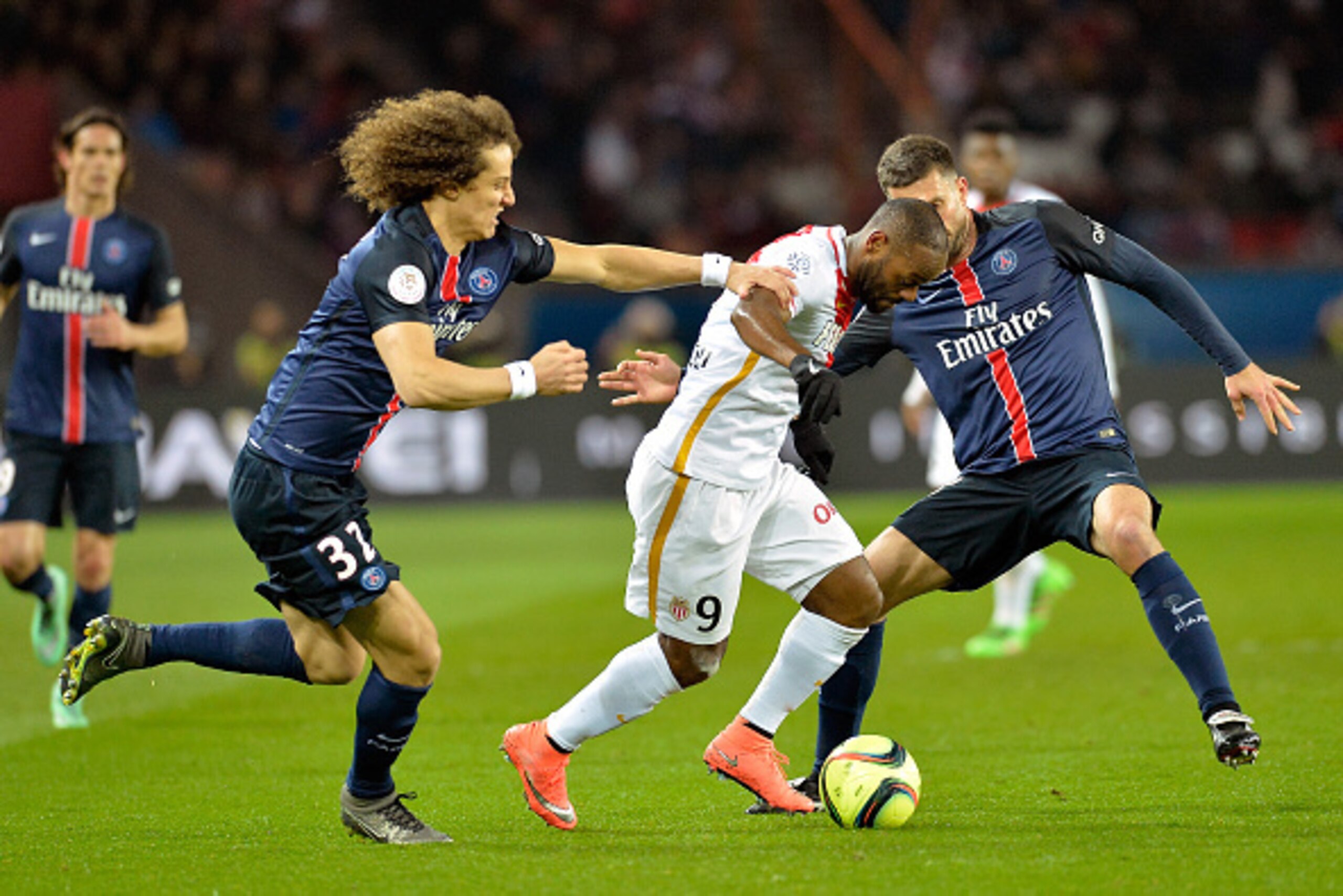 PARIS, FRANCE - MARCH 20:  David Luiz of Paris Saint-Germain and Vagner Love of AS Monaco fight for the ball during the French Ligue 1 match between Paris Saint-Germain and AS Monaco at Parc des Princes on March 20, 2016 in Paris, France.  (Photo by Aurel
