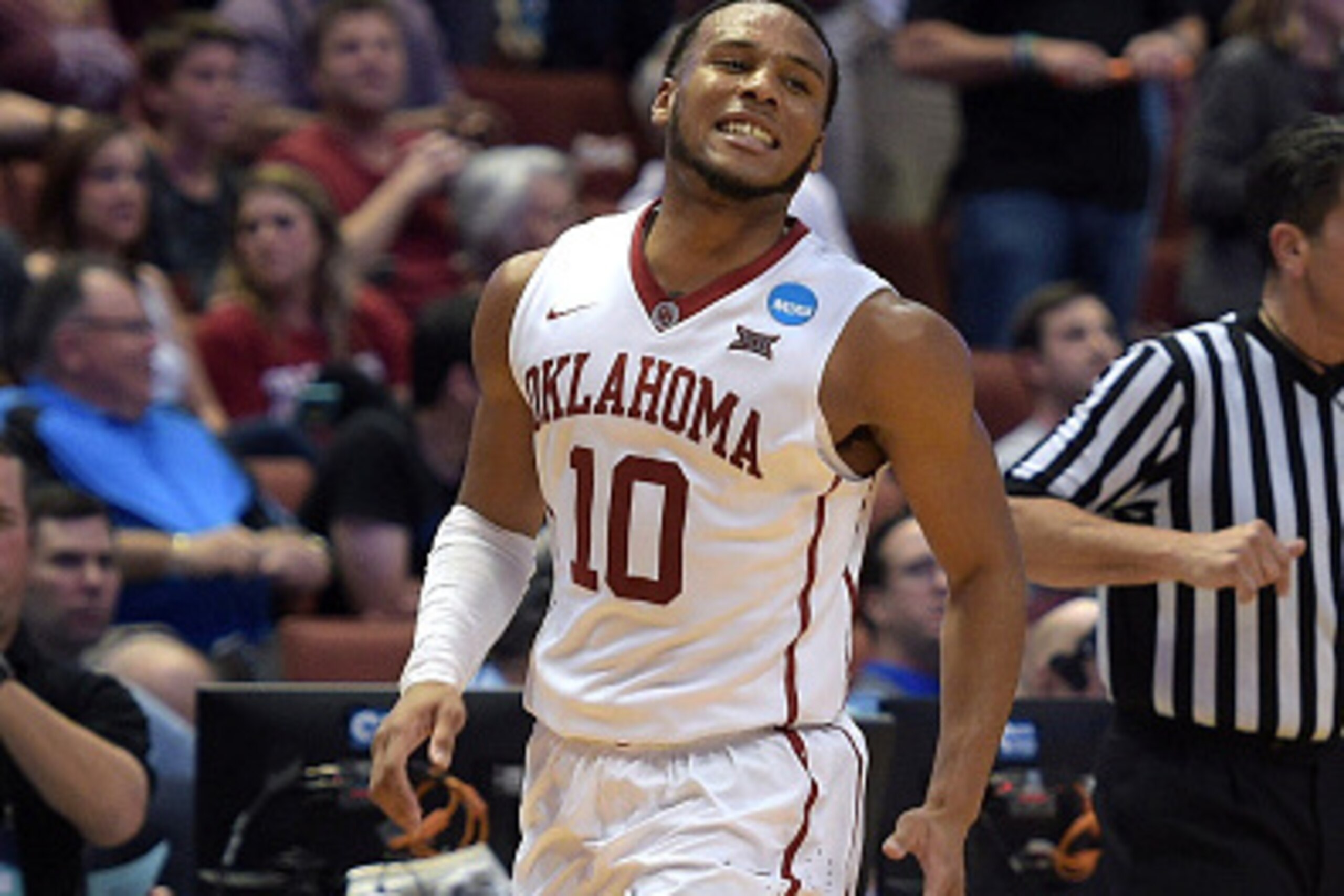 ANAHEIM, CA - MARCH 24: Jordan Woodard #10 of the Oklahoma Sooners reacts against the Texas A&M Aggies during the West Regional Semifinal of the 2016 NCAA Men's Basketball Tournament at Honda Center on March 24, 2016 in Anaheim, California. (Photo by Lanc